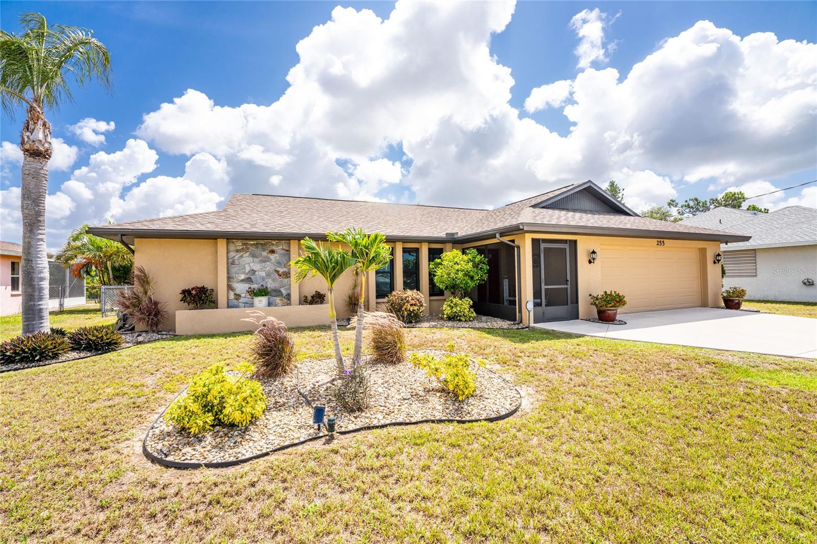 Affordable Florida living awaits in this well-maintained two-bedroom, two-bath home with an oversized two-car garage, located in the popular deed-restricted golf course community of Rotonda West. A lovely screened and tiled front entry welcomes you inside, where you'll find a thoughtfully designed split-bedroom floor plan with no wasted space.

The spacious living room features a cathedral ceiling, ceiling fan, and three updated impact-resistant front windows that provide abundant natural light. Just off the living room is a versatile bonus area, perfect for a small home office, reading nook, or hobby space.

The updated kitchen offers Wilsonart textured countertops, subway tile backsplash, closet pantry, and a convenient pass-through double-hung window to the lanai. A full suite of GE stainless steel appliances, including a French-door refrigerator, microwave, smooth-top convection range with air fryer, and dishwasher, complete the space. The adjoining dinette area is accented by a charming reclaimed wood feature wall.

The primary suite features vinyl plank flooring, a walk-in closet, sliding glass doors leading to the lanai, and an updated en-suite bath with a solid-surface vanity, new mirror, lighting, and toilet. The guest bedroom is equally inviting with vinyl plank flooring, ceiling fan, and wall closet, while the adjacent guest bath with it's combo tub/shower has been tastefully updated with a solid-surface vanity, new lighting, mirror, & toilet. 

The two-car garage includes a stack washer/dryer and free standing cabinetry, a utility sink, automatic garage door opener, and updated impact-rated overhead and man door. Outdoor living is easy on the spacious screened lanai, featuring plank tile flooring and dual ceiling fans, creating the perfect spot to relax and enjoy Florida's beautiful weather.

Additional updates include a new shingle roof  completed in 2023. The air conditioning system was recently serviced and inspected, and the home has successfully passed a four-point inspection. The backyard offers added privacy with a lush pitch apple hedge and other tropical landscaping.  Best of all, the property is located outside of a designated flood zone, meaning flood insurance is not typically required by lenders.

Rotonda West offers an exceptional lifestyle with a low annual HOA fee of just $190 and amenities including a clubhouse, playground, tennis courts, Circle Park, and Broadmoor Park. Beautiful Gulf beaches, boating opportunities in Lemon Bay and Boca Grande, and world-class fishing are all just a short drive away.
