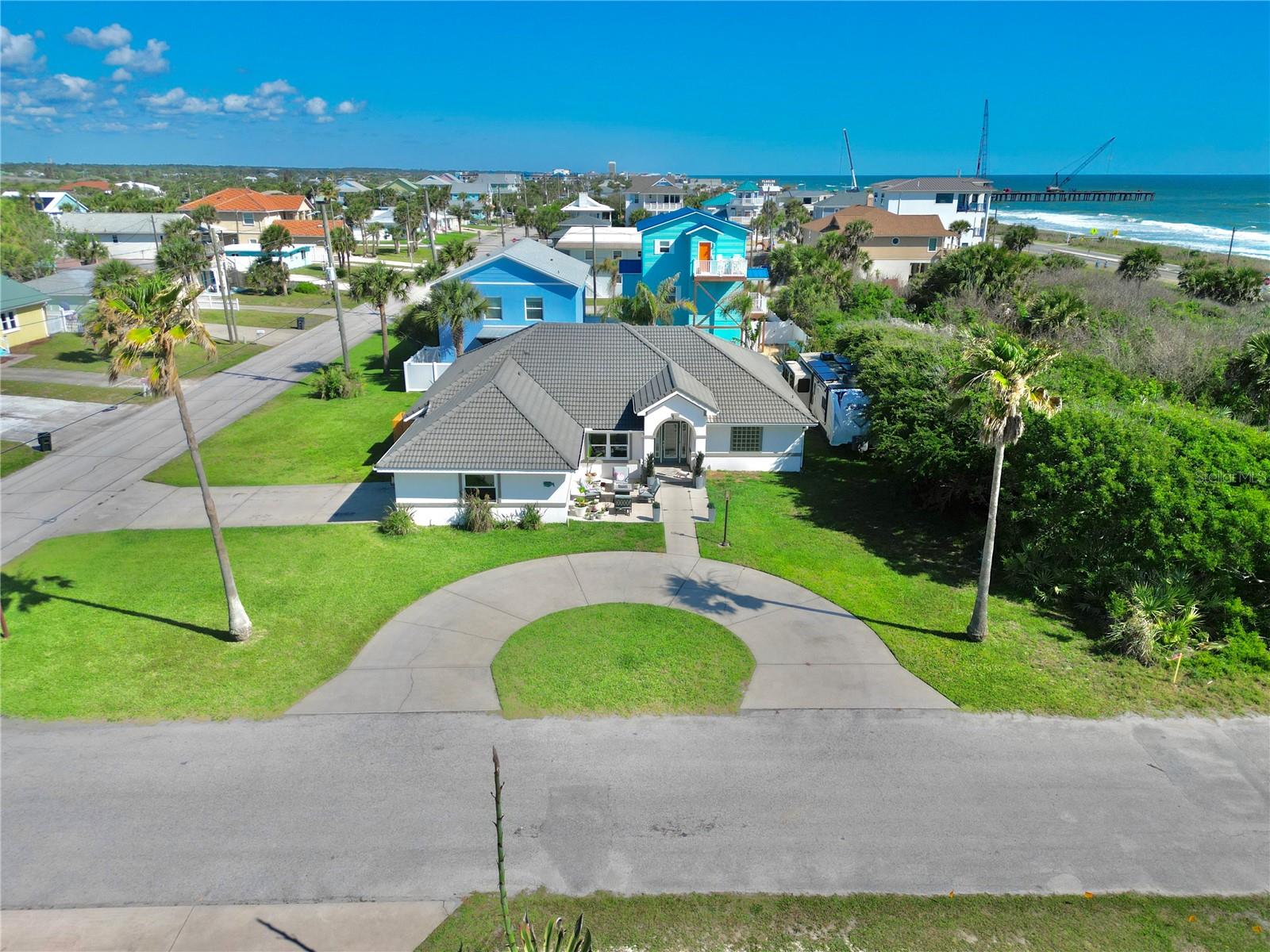 Discover modern coastal living just 100 feet from the ocean in this beautifully built 4-bedroom, 2-bath beach home offering 2,500 sq ft of relaxed luxury. Light, open, and inviting, the home features a chef’s kitchen with granite countertops and GE Café black stainless appliances, a formal dining area, and a spacious primary suite with dual walk-in closets, jetted garden tub, oversized shower, and dual vanities.
Set on a rare oversized corner double lot (100 x 100), there’s room for a pool, boats, jet skis, an RV, or trailers, all while enjoying peace of mind with a tile roof, stucco exterior, hurricane-rated windows, and desirable Flood Zone X location. Walk or bike to downtown Flagler Beach restaurants, shops, parks, tennis and pickleball courts, trails, the pier, and one of Florida’s dog-friendly beaches.
Whether you’re looking for a full-time coastal retreat or seasonal escape, this home offers the perfect blend of comfort, strength, location, and beachside lifestyle. Your Flagler Beach paradise awaits.