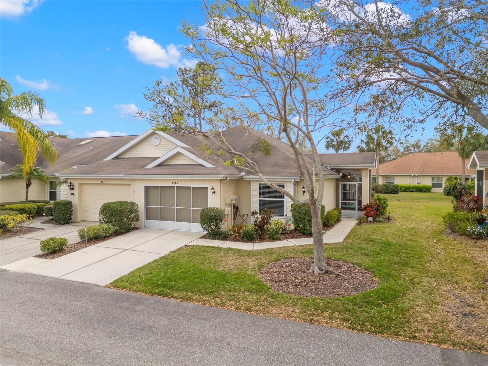 QUICK CLOSING AVAILALBE and MOTIVATED SELLER! NEW ROOF INSTALLED AUGUST 2025! This is a fully furnished TURN-KEY home that includes linens, a fully stocked kitchen, beach accessories, golf clubs and more! There is No CDD and No Flood Insurance Required on this MAINTENANCE FREE condo with 1,357 sq ft of living space that has 2 bedrooms, 2 bathrooms and a versatile sunroom. As an END UNIT, there will be more natural lighting with the exterior wall windows! Your entry features a screened and covered front porch, perfect for welcoming guests and packages, and is an ideal spot to enjoy your morning coffee or an evening beverage. Custom paint adorns the great room and has a living space complete with cozy seating and a dining room that is nestled into the bay window! The kitchen has an abundance of cabinetry, a newer refrigerator (2021), an eat-in space, and a breakfast bar where guests will gather! The primary bedroom is generously sized, accommodating larger furniture, and includes an en-suite bathroom complete with a walk-in shower and comfort-height toilet. The secondary bedroom features a window seat and convenient access to the second full bathroom, ensuring privacy for your visitors. The sunroom is level with the living room, providing a seamless extension of the home and offering space for an office, game/craft room and more! The laundry is INSIDE and has racks for storing items and hanging clothes. The garage comfortably fits your vehicle and includes screens to keep pests out while allowing fresh air in! Plus, a GOLF CART is available for purchase with this property! Additional features and updates include a whole house water filtration system, newer hot water heater (2022), a new AC compressor (2024), ceiling fans and blinds throughout and high ceilings! This is a PET-FRIENDLY location where an AGE-WAIVER is possible if under 55! Kings Point has two guard GATED entrances and GOLF CARTS are welcome. Fees include cable, internet, exterior insurance, maintenance grounds, private road, security, water, trash, sewer & more! This ACTIVE 55+ community has over 200 clubs, multiple indoor/outdoor HEATED pools, state of the art fitness, pickle ball, and so much more! If you plan on venturing out there is quick access to restaurants, SHOPPING, beaches and 30 minutes to Tampa International Airport, less than an hour to the Sarasota shops and 20 minutes to Ellenton Prime Outlets!