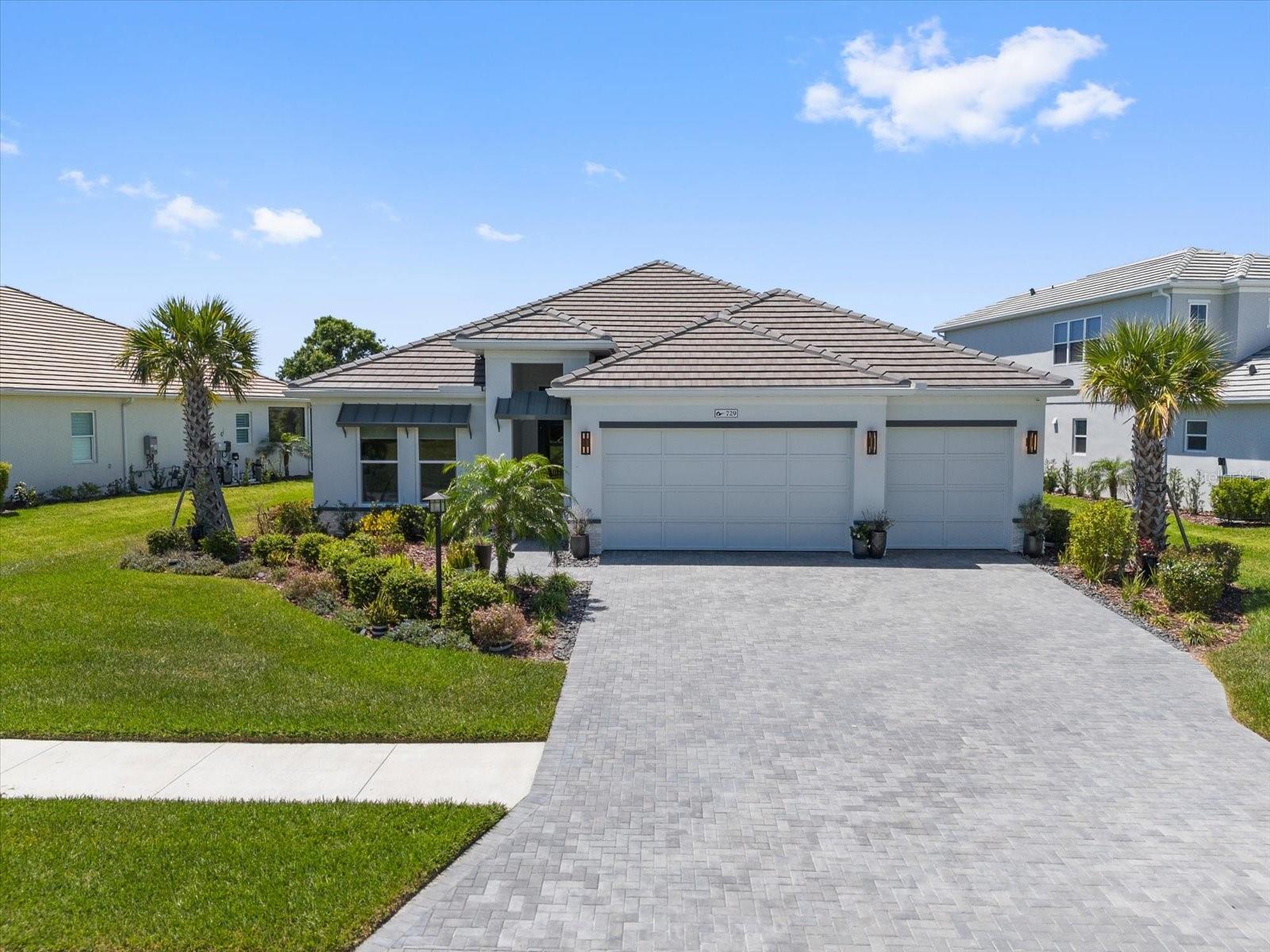 This home has many upgrades to consider. on a 65' lot collection & Larger than most lots on preserve. 3 Bedrooms, Plus Den/Office. 2 full baths, and 1 pool bath. Comes With FULL impact glass windows and doors throughout, Heated Pool with Spa, water feature and lights. Full security and cameras, Customized kitchen with extended solo island, added kitchen window over sink, added pool bath, two added exterior doors to lanai and pool area from kitchen and master, extended drive way, and no houses across the street in the front. 3 Bedrooms, Plus Den/Office.2 full baths, and 1 half pool bath. FULL impact glass windows and doors throughout, Heated Pool with Spa, water feature and lights. Larger than most lots on preserve. Full security and cameras, Customized kitchen with extended solo island, added kitchen window over sink, added pool bath, two added exterior doors to lanai and pool area from kitchen and master, extended drive way, and no houses across the street in the front. Custom designed main bath with dual vanities, half privacy for WC, oversized soaking tub, tile in both showers to the wall, upgraded tiles, counters, and full house luxury vinyl. (With exception of baths and laundry). custom laundry cabinets with farm house sink (great for dog baths). Kitchen with Zline appliances, and dual wine fridge. Custom main closet with drawers and shoe shelves, upgraded kitchen pantry shelves. Built ins in living room, added LED hookups, Smart house...and more. Note: No outside kitchen but there is room to add. Water filter whole house, electrical plug for EV Please note viewing this home there are active cameras inside the home. The Community has many social activities and great pool, fitness center club house and more. Come tour for yourself. All information to be verified with tax records, HOA and own buyer's due diligence. Required CDD verify amount, and HOA contributions at closing $750 CC and $2500 amenity fee. (lanai drapes in photos removed as not allowed by HOA)