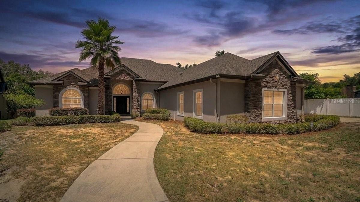 Experience the perfect blend of elegance, comfort, and privacy in this beautifully custom-built home nestled on a cul-de-sac with a private gated entrance. Offering 3 bedrooms, including two spacious primary suites, 2 bathrooms, a office, and exceptional craftsmanship throughout, this home is truly one of a kind. Inside, you’ll find beautiful crown molding throughout, large windows that fill the home with natural light, and a cozy gas fireplace that anchors the inviting living space. The thoughtfully designed floor plan includes a formal living room, formal dining room, breakfast nook, and a spacious kitchen featuring a large breakfast bar and a walk-in pantry—ideal for entertaining and everyday living. The primary suite is a relaxing retreat with a garden tub, separate walk-in shower, and generous space to unwind. Both primary suites offer access to their own private lanais, providing peaceful outdoor spaces to enjoy the beautiful surroundings.
Additional highlights include an inside laundry room, a 2-car garage with epoxy-coated floors, and a roof that was replaced just one year ago for added peace of mind. Outside, enjoy the beauty of mature Key lime and avocado trees, adding both charm and the opportunity to enjoy fresh fruit right from your own backyard. If you’re looking for a custom home that offers quality craftsmanship, privacy, and a tranquil setting while remaining convenient to shopping, dining, and everyday amenities, this exceptional property is a must-see.