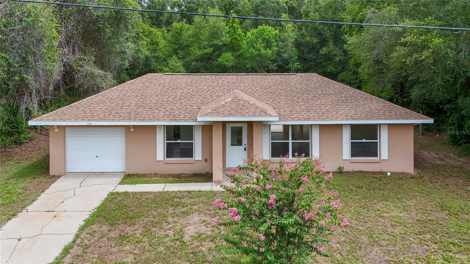 Welcome home to this well-maintained 2 bedroom, 2 bathroom residence in Inverness Acres, offering 1,008 sq ft of comfortable living space on a 0.23-acre lot. Recent updates include a new roof (2024), new laminate flooring, and a freshly repainted interior, creating a clean and welcoming feel throughout. The split bedroom layout features vaulted ceilings, a breakfast bar, laminate counters, and a walk-in closet in the primary suite with a step-in shower.The fully fenced backyard provides a private outdoor space suitable for relaxation, pets, or gardening. The property’s location offers a tranquil setting while still being close to everyday conveniences, including nearby shopping, dining, and services in downtown Inverness.Enjoy easy access to the Nature Coast’s lakes, parks, and multi-use trails, including the Withlacoochee State Trail and the region’s well-known freshwater recreation areas. The home is located in a USDA loan-eligible area and offers convenient regional connectivity: approximately 25 minutes to Crystal River, 35 minutes to The Villages, 45 minutes to Ocala, 1 hour to Tampa, and 1 hour 15 minutes to Orlando.