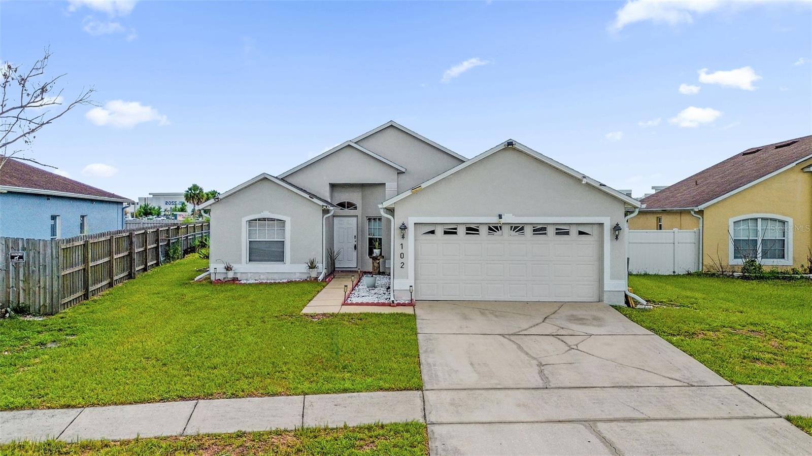 Welcome to 102 Saffron Way in Kissimmee! This beautifully maintained 3-bedroom, 2-bathroom home offers 1,562 square feet of comfortable living space in the established Cypress Woods community. Designed with an open-concept layout, the home features a spacious living and dining area that flows seamlessly into the kitchen, complete with stainless steel appliances, abundant counter space, and a convenient breakfast bar perfect for everyday living and entertaining. The private primary suite offers a generous walk-in closet and an en-suite bathroom for added comfort. Step outside to enjoy the screened lanai and fully fenced backyard, creating the perfect space for relaxing, hosting family and friends, or letting pets play safely. Additional features include a 2-car garage, low-maintenance landscaping, and a prime location just minutes from shopping, dining, schools, medical facilities, and major roadways providing easy access throughout Central Florida. Whether you're a first-time homebuyer, downsizing, or looking for a smart investment opportunity, this move-in-ready home offers exceptional value and convenience. Schedule your private showing today!