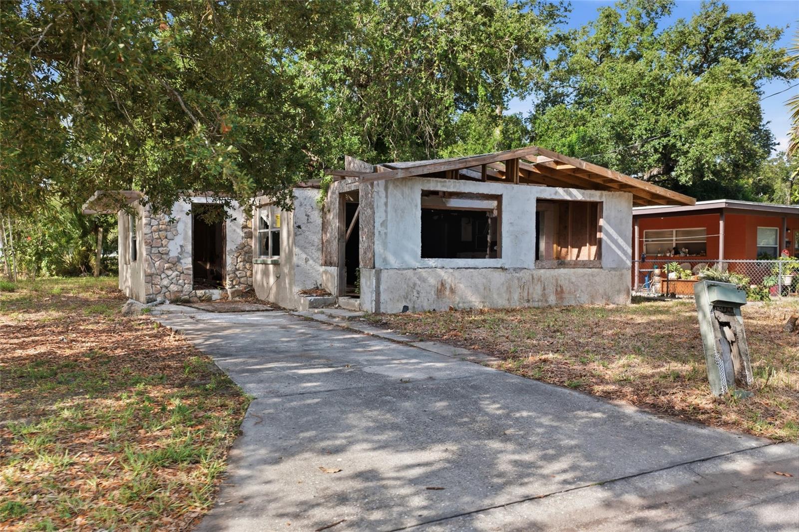 Exceptional Land Value Opportunity in a Prime Bradenton Location!  The existing structure is not habitable and is being offered as a teardown, presenting a rare opportunity to build your dream home or next investment project in one of Bradenton's most convenient locations. Nestled between Bradenton and Sarasota, this homesite offers exceptional access to everything the Gulf Coast has to offer. Enjoy being just minutes from the Manatee River, vibrant downtown Bradenton, and a short drive to downtown Sarasota, the marina district, St. Armands Circle, and the world-renowned beaches of Siesta Key and Lido Key. With quick access to US-301 and US-41, commuting throughout the Sarasota-Bradenton corridor is effortless. The lot features mature oak trees, established landscaping providing an excellent foundation for future development. Located on a quiet residential street surrounded by established homes, the property offers outstanding potential for new construction in an area experiencing continued growth and redevelopment. Whether you're a builder, investor, or future homeowner looking to create a custom residence, this property presents an incredible opportunity to secure a homesite in a highly desirable location close to shopping, dining, entertainment, waterfront attractions, and Florida's beautiful Gulf Coast lifestyle. Bring your vision and make the most of this exceptional homesite. Opportunities like this in such a central location are becoming increasingly rare. Is this lot your perfect match?!