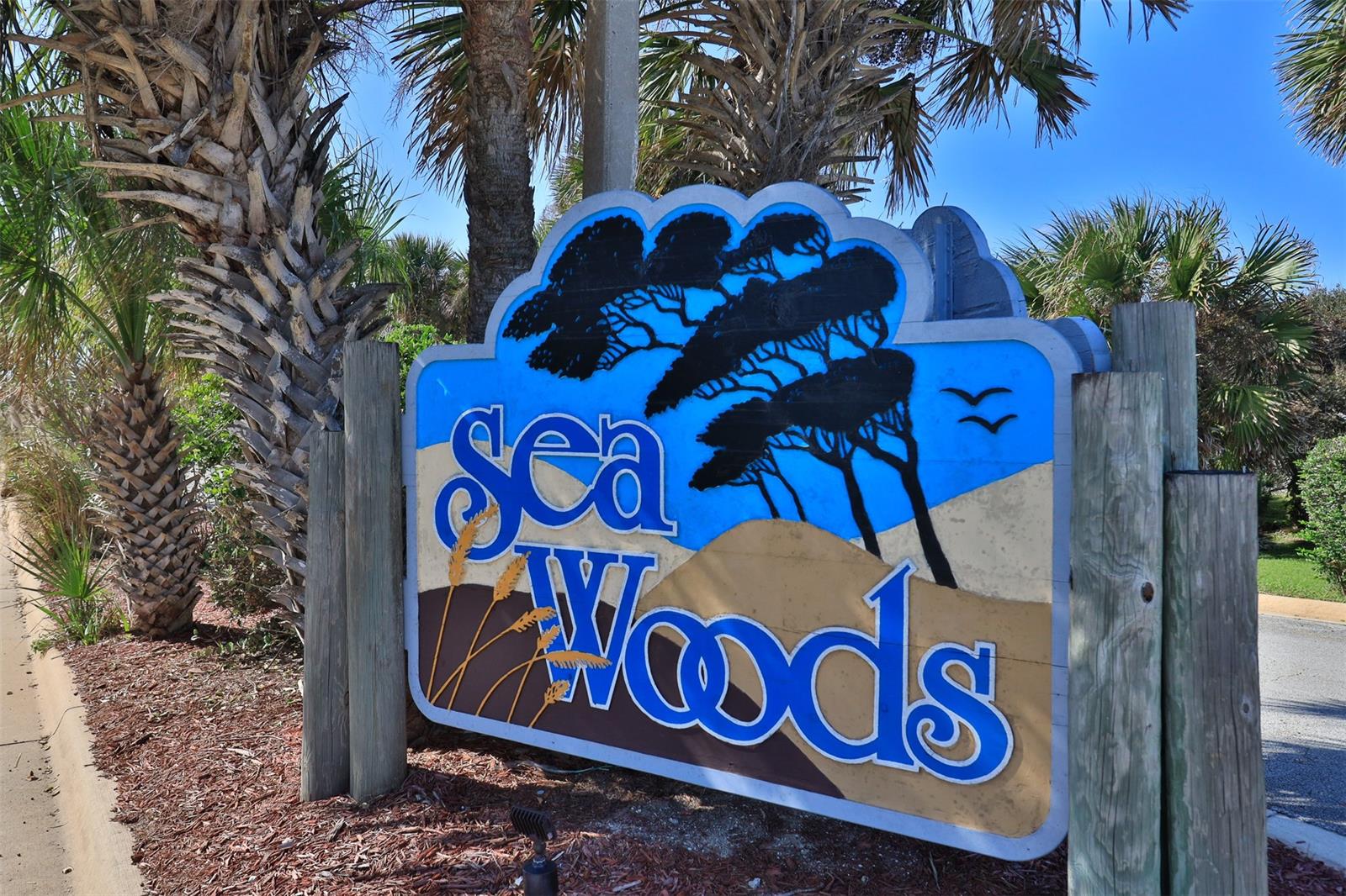 STUNNING 2nd floor, 2 Bedroom, 2 Bath condo located in the popular beach side community of Sea Woods!  This condo features a bright & cheery decor with blonde hardwood floors in the main living area plus a balcony facing east with a large retractable awning to shelter you from the sun & rain! It is a great place to read the morning newspaper, place a game of Cribbage or take a nap! Beautifully updated kitchen with Stainless Steel appliances newer kitchen cupboards & a nice view out the kitchen window. The owners take great pride in having this condo perfectly prepared for their guest's to arrive, relax and enjoy their immaculate, well equipped home away from home!
It is located close to one of the three Sea Woods pools, Pickle Ball Courts, Tennis Courts and one of three access points leading to New Smyrna's Famous Car Free Beach! Sea Woods is a 53 acre seaside community featuring a naturally wooded landscape with Old Florida Scrub Oaks, Palm Trees, lush foliage, hammocks and sand dunes. There are bike & walking paths, on site management, a fitness center, clubhouse, & lots more to enjoy. Best of all... Sea Woods has nice, friendly people! ;LocationDescription: Condo