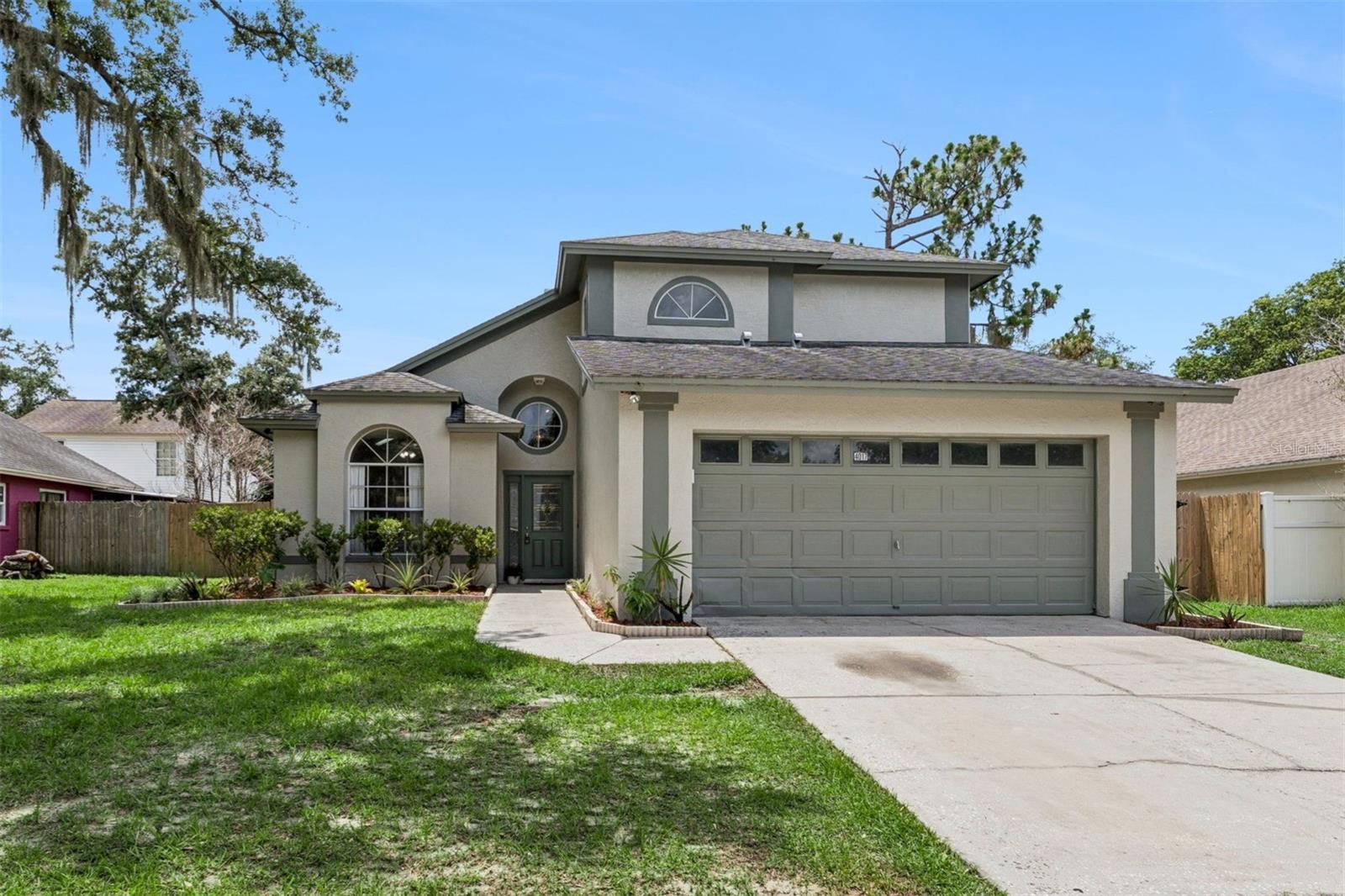 FRESH NEW PAINT INSIDE - BRAND NEW APPLIANCES - ALL NEW PLUMBING - MAY 2026. Fall in love with this OPEN CONCEPT - MOVE-IN READY home with stunning 20+ foot VAULTED CEILINGS complete with a FENCED-IN backyard in the highly desirable BLOOMINGDALE EAST neighborhood. This beautiful home has 3 bedrooms, 2 1/2 bathrooms, 1693 Square Feet, a 2 car garage, and has the added benefit of a FIRST FLOOR PRIMARY BEDROOM SUITE. The beautiful landscaping frames the home perfectly, with vibrant greenery that enhance its curb appeal. Thoughtfully placed plants and mature trees provide both beauty and shade, adding to the home’s warm and welcoming atmosphere.  The yard is fully FENCED-IN and has plenty of room to enjoy as is, or even to add a pool or firepit area to enjoy spending time with your friends, family, and neighbors. Step inside and you will immediately feel at home.  The VAULTED CEILINGS maximize the natural light that pours in from the tall windows and the sliding glass door.  Notice how much space you will have for entertaining your family or friends, and the beautiful FIREPLACE that ties it all together. Enjoy the morning sun in the spacious EAT-IN kitchen which features a storage PANTRY and ALL BRAND NEW APPLIANCES just delivered! Relax in the SPACIOUS primary bedroom that boasts a WALK-IN CLOSET and a primary bathroom with a LARGE GARDEN TUB, DUAL SINKS, and a STAND UP SHOWER. The laundry is conveniently on the first floor, as well as the 1/2 bath. The peaceful, covered, screened-in patio is ideal for morning coffee or evening unwinding. The 2 car garage offers plenty of storage space, and features an extra REFRIGERATOR for storage of bulk groceries, meal prep, and large party platters, while keeping your main kitchen unit from getting overcrowded. The other two bedrooms are upstairs, along with the FULL BATHROOM and the SPACIOUS loft, which can easily be turned into a FOURTH BEDROOM. The Bloomingdale community has great schools nearby and is in the heart of Valrico. It's close to Highway I-75 & I-4, shopping, restaurants, hospitals, parks, the YMCA, gyms, little league fields, and a quick ride to downtown. No CDD, and an optional $42/year HOA fee! Don't miss your chance to live in a charming home! Schedule your showing today before its gone!