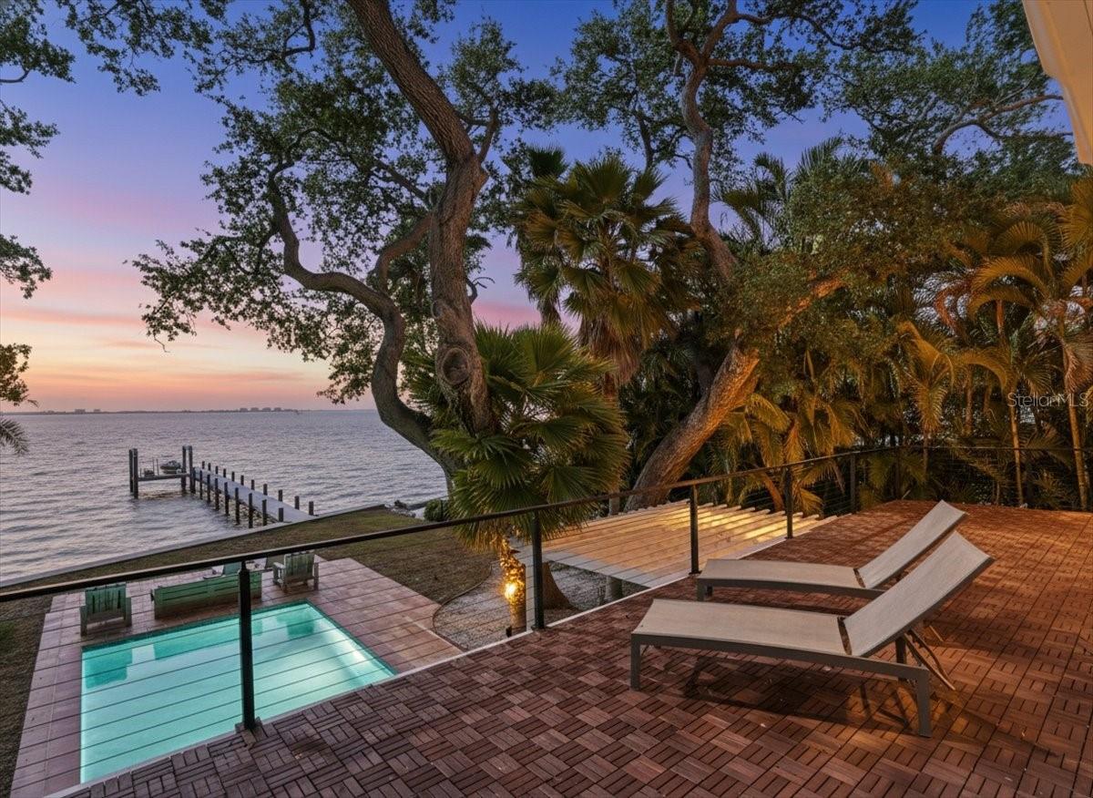 60% OWNER FINANCING AVAILABLE - Open the gate and arrive at your private waterfront retreat on Bay Shore Road, where every day revolves around the water. Step into your backyard and onto your dock, complete with a dedicated jet ski and kayak lift platform (can be converted easily to boat lift), designed for effortless access and enjoyment.
Spend your days by the pool and your evenings taking in sunset views over the bay from the pool deck or the large master bedroom balcony. This is waterfront living that feels both private and effortless.
The home has been thoughtfully upgraded to enhance both comfort and resilience, featuring impact glass windows and doors for added protection during storms. Notably, the house DID NOT EXPERIENCE FLOODING during recent major hurricanes.
Recent improvements include brand new sand finish stucco, new seawall, new dock with jet ski and kayak lift platform, new pool heater, Tesla charger, and two new gate motors. An impact-rated garage door is currently being installed.
Set behind a private gate and located just minutes from downtown Sarasota, dining, and shopping, this property offers a rare combination of lifestyle, upgrades, and location.