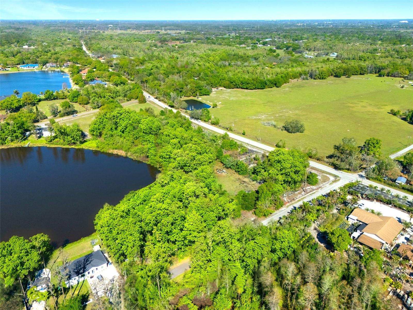 A rare opportunity to own lakefront acreage in the coveted Keystone corridor of Odessa. This
pristine property sits directly on the crystal-clear, 10-acre spring-fed Lake Jackson, delivering
sparkling water views and an unparalleled sense of privacy and natural beauty.
Two contiguous parcels combined for a total of 10 acres MOL
 one with frontage on Boy Scout Road and the other on Burrell
Road to be sold together—providing flexibility for a sprawling private estate or multi-use retreat.
Set among Odessa’s most desirable homes and equestrian estates; this land offers endless
possibilities. Build your luxury residence with pretty lake vistas, create an equestrian haven
complete with barn, pasture, and round pen, or design a peaceful compound with room to grow. The
gently rolling landscape, mature Florida foliage, and tranquil lakefront setting combine to create a
truly exceptional piece of property that rarely becomes available. This is a must see in person
property to fully appreciate the topography, views and possibilities!
Highlights:
Pretty water views across a quiet, private lake
Premium location on Boy Scout Rd and Burrell Rd
Perfect for a private luxury estate or equestrian use
Serene, natural surroundings while still close to top-rated schools, dining, and amenities
A rare opportunity in one of Hillsborough County’s most coveted lakefront corridors
Whether you envision an elegant homestead overlooking shimmering water or an equestrian
lifestyle property with open space and serenity, this Odessa lakefront acreage provides a
stunning natural backdrop that defines exceptional lakefront living.
Realtor Remarks: This property truly should be walked to fully appreciate it. Schedule showing. Call Pamela for your appointment.
NOTE: This property is to be sold together with the adjacent Listing 18117 Boy Scout Road. Price includes both parcels.