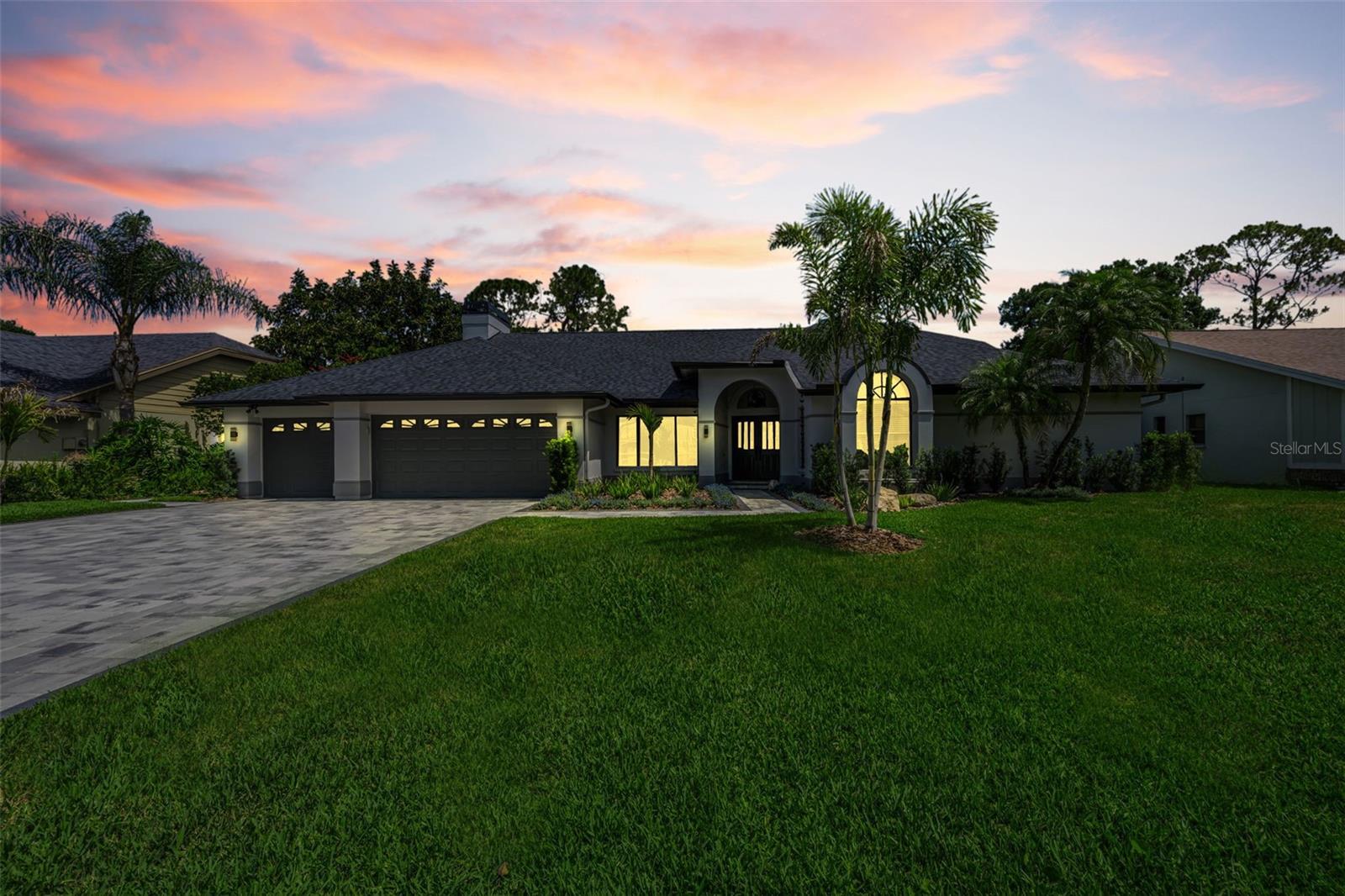 Welcome to 6207 Iroquois Ct in the highly sought-after Belle Meade community, where timeless Florida ranch charm meets a comprehensive modern renovation. This impeccably maintained 4-bedroom, 2.5-bath residence with a 3-car garage offers nearly 3,000 SF of refined living space on a spacious 95’ x 145’ waterfront homesite backing directly to a tranquil pond, thoughtfully designed for both everyday comfort and elevated entertaining.
 
Extensively updated from 2023–2025, this home delivers exceptional peace of mind with major improvements including a new roof, exterior paint, gutters with guards, professional landscaping and sod, paved driveway and sidewalks, outdoor lighting, artificial turf dog run, new air ducting, and pool cage rescreening. The resort-style outdoor living area was further enhanced with a newly resurfaced pool, brand new HVAC system, and a custom epoxy-finished lanai and pool deck, creating a seamless indoor-outdoor lifestyle.
 
Inside, soaring vaulted ceilings and a bright open-concept layout set the tone for the home’s sophisticated yet inviting feel. Wide-plank flooring, upgraded lighting, modern hardware, and a fully refreshed interior aesthetic elevate every space. The chef’s kitchen features a dramatic 10’ island, high-end GE Café appliances, quartz countertops, abundant cabinetry, and a built-in coffee bar perfectly suited for entertaining.
 
At the center of the home, the expansive family room showcases a wood-burning fireplace, dry bar, custom built-ins, and three sets of multi-pane sliding glass doors that open directly to the lanai, filling the space with natural light and creating effortless indoor-outdoor flow. A desirable split floor plan provides both privacy and functionality, highlighted by a spacious primary suite with dual walk-in closets, while additional bedrooms and flexible living spaces easily accommodate guests, a home office, or growing families.
 
Step outside to your private outdoor oasis featuring an oversized screened lanai with dedicated dining and lounge areas, a built-in grill and outdoor kitchen, bar seating, Bluetooth speakers, and a heated saltwater pool with spa overflow—all overlooking tranquil waterfront views. The fenced-in yard and dedicated turf dog run complete the exterior experience.
 
Additional highlights include a freshly painted epoxy garage floor, updated irrigation system, and enhanced neighborhood curb appeal with newly paved roads, sidewalks, and street lighting throughout the community.
 
Belle Meade offers an unbeatable location near premier shopping, dining, entertainment, top-rated schools, the Veterans Expressway, Tampa International Airport, I-275, and the world-renowned Gulf beaches. With NO CDD, LOW HOA fees, and NO FLOOD INSURANCE REQUIRED, this home presents a rare opportunity to own a truly move-in ready luxury property in one of the area’s most desirable communities.
 
Experience Florida living at its finest. Schedule your private showing today.