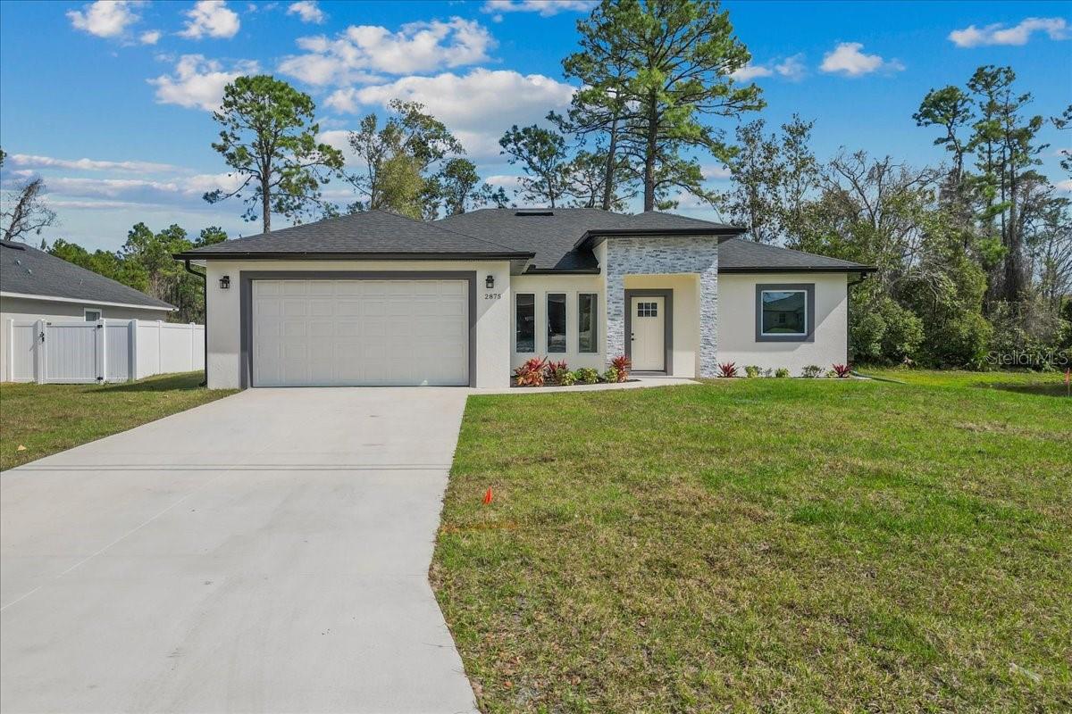 Stunning Brand-New 4-Bedroom Waterfront Retreat! Welcome to this beautifully crafted new construction home featuring 4 bedrooms, 2.5 bathrooms, a desirable split floor plan, and tranquil waterfront views. Thoughtfully designed with both style and functionality in mind, this residence offers an open-concept layout enhanced by upscale finishes throughout.

The gourmet kitchen is a true centerpiece, showcasing stainless steel appliances, quartz countertops, a designer backsplash, and an oversized breakfast bar ideal for entertaining or casual dining. Flowing seamlessly into the dining and living areas, the space opens to scenic lanai and conservation views, creating the perfect indoor-outdoor lifestyle.

The private primary suite is tucked away for maximum comfort and features direct lanai access, dual walk-in closets, and a luxurious ensuite bath complete with dual vanities and a spacious walk-in shower. Bedrooms 3 and 4 share a convenient full bath, while Bedroom 2 is privately situated, making it ideal for guests, a home office, or flex space.

Enjoy peaceful mornings and stunning sunsets from the covered lanai, accessible from both the dining area and primary suite. Backing to a conservation area with no rear neighbors, this home offers exceptional privacy and a serene natural setting.

Loaded with premium upgrades already included - with no additional builder costs - this exceptional waterfront home is truly move-in ready and a must-see!