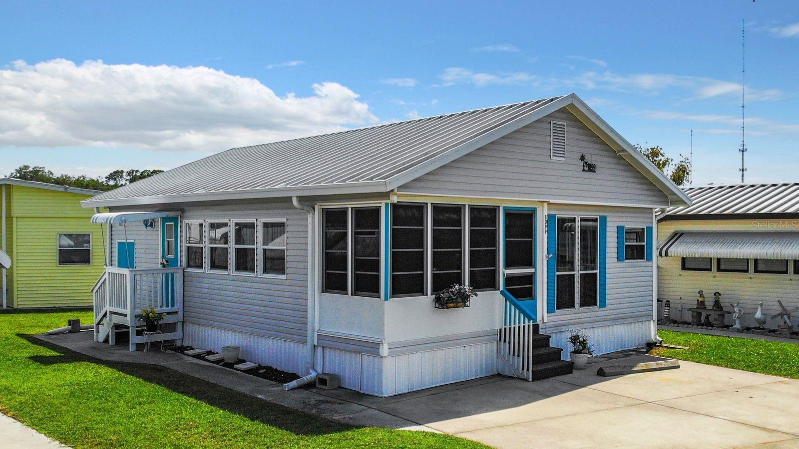 CHEEFUL MOBILE HOME IN ACTIVE 55+ COMMUNITY in Bradenton, Florida! So much to offer in this FURNISHED one bedroom, 1.5 bath home. Beach vibe & decor throughout. Relax on the enclosed front porch or in the comfortable living room. The large closet off the living room provides extra storage. Off the dining room is the primary suite with full bathroom and extra storage cupboards. There is a stacker washer/dryer unit in the half bath. All appliances included! Central a/c, metal roofover, room to park two vehicles, and a 48 sq ft storage shed help make this home easy to live in. Sugar Creek Country Club has LOW HOA FEES OF $600 PER QUARTER which include internet, cable, grass mowing, water, sewer and trash. There are 2 swimming pools, heated spa, clubhouse, tennis, pickleball, shuffleboard, a fitness room, and workshop. There is an active social calendar during the winter months. Enjoy this community's proximity to River Links Golf Course and the Braden River.  Sorry, this is not a dog lot.