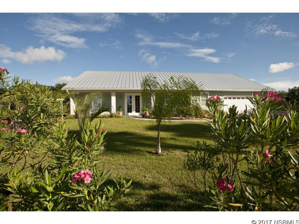 2014 Custom Built Waterfront Home on a Quiet Flower Filled Acre, and just 15 minutes from the Beach. This Wonderful home is Open and Spacious, with  a Picturesque Setting that provides the Ultimate in Peaceful Settings. 280 Feet of Water Frontage. Incredibly well Constructed with Hardy Board over Concrete Block Exterior, Impact Glass, Foam Insulation. An 8 x 16 Floating Dock is Perfect For a Small Boat. Live Your Life among the Oleanders !!!!! ;Water: City