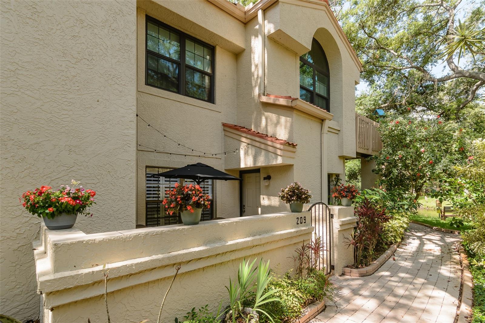 Welcome home to one of Safety Harbor's most desirable communities-Los Prados! Resort style living! Tucked away in a peaceful location at the rear of the complex, this beautifully maintained condo offers a tranquil setting surrounded by mature landscaping and views of the beautiful pond and fountain. 
Residents enjoy exclusive access to a private gate leading directly to Folly Farm Nature Preserve and Community Garden, while downtown Safety Harbor's vibrant restaurants, breweries, shops, parks, marina, and waterfront along Tampa Bay are only a short bike ride away (1 mile)
Step inside to discover numerous updates throughout, including beautiful plantation shutters throughout, interior paint, baseboards, crown molding, updated lighting fixtures, custom closet shelving, and elegant French doors leading to the primary bathroom. The kitchen features quartz countertops, stainless steel appliances, updated tile flooring, and a stylish tile backsplash. Both bathrooms have been enhanced with granite countertops, glass shower doors, and updates to the guest bath including an updated shower and tile flooring.
A spacious front patio provides the perfect place to enjoy your morning coffee while taking in the lush tropical landscaping. Additional features include a dedicated laundry room and ample storage throughout. For added peace of mind, the HOA maintains the roof which was just redone in 2025, helping make ownership even more convenient. The water heater is 2019. A/C 2020. Electric Panel 2023. Washer/Dryer summer of 2025.
Ideally situated near the community pond and surrounded by the natural beauty that makes Safety Harbor so special, this home offers the perfect combination of comfort, convenience, and Florida living.