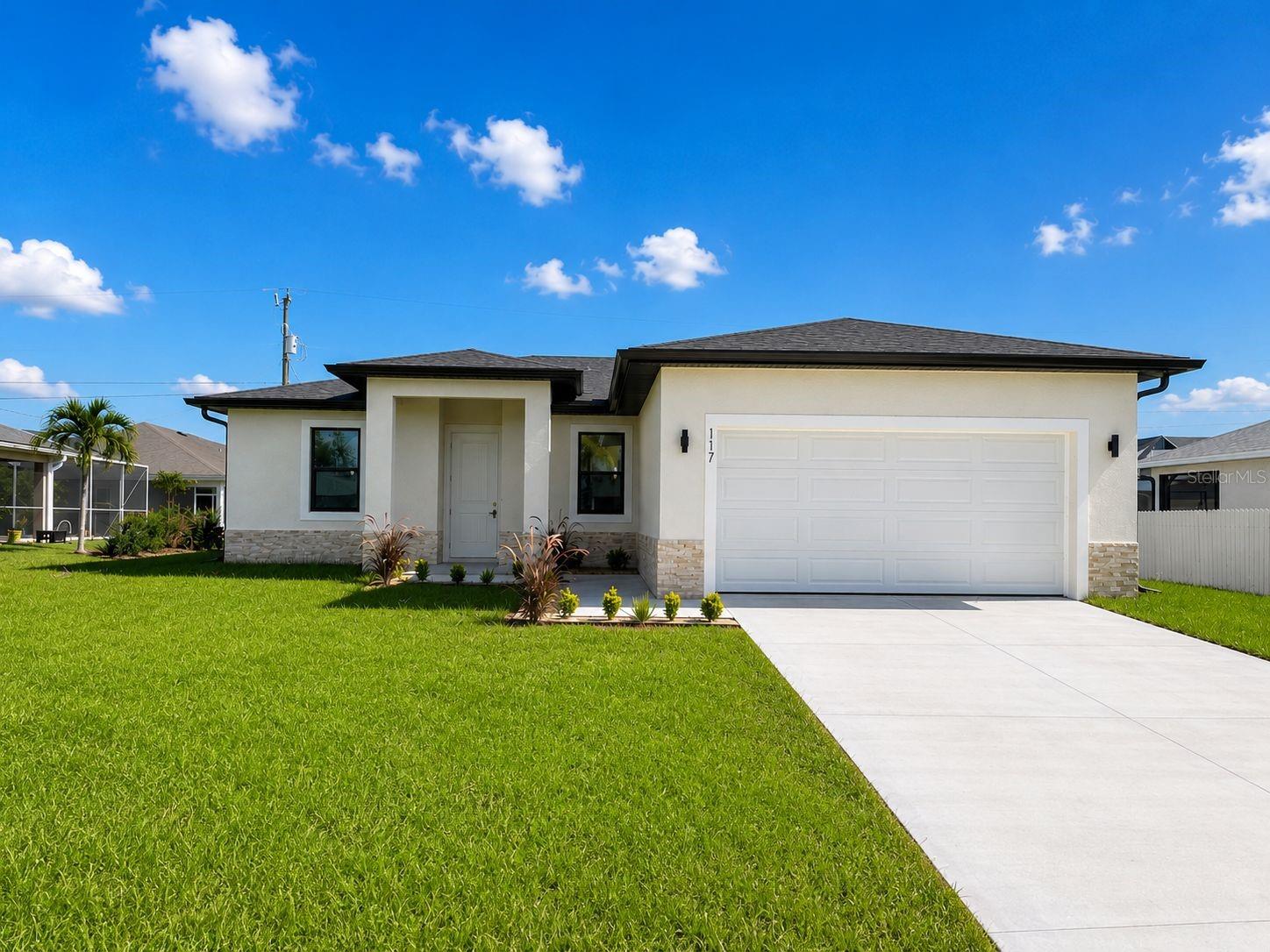 Stunning brand-new construction in Cape Coral featuring 4 bedrooms, 2 bathrooms, and modern high-end finishes throughout. This beautifully designed home offers porcelain tile flooring, tray ceilings, spacious bedrooms, and an open-concept layout ideal for both everyday living and entertaining. The modern kitchen is the centerpiece of the home, showcasing a large island, sleek cabinetry, and a stylish range hood. Bathrooms feature elegant floor-to-ceiling tile finishes, adding a luxurious touch. Equipped with a smart home system for added comfort and convenience. No HOA! Conveniently located near shopping, dining, schools, and major roadways in one of Cape Coral’s fastest-growing areas