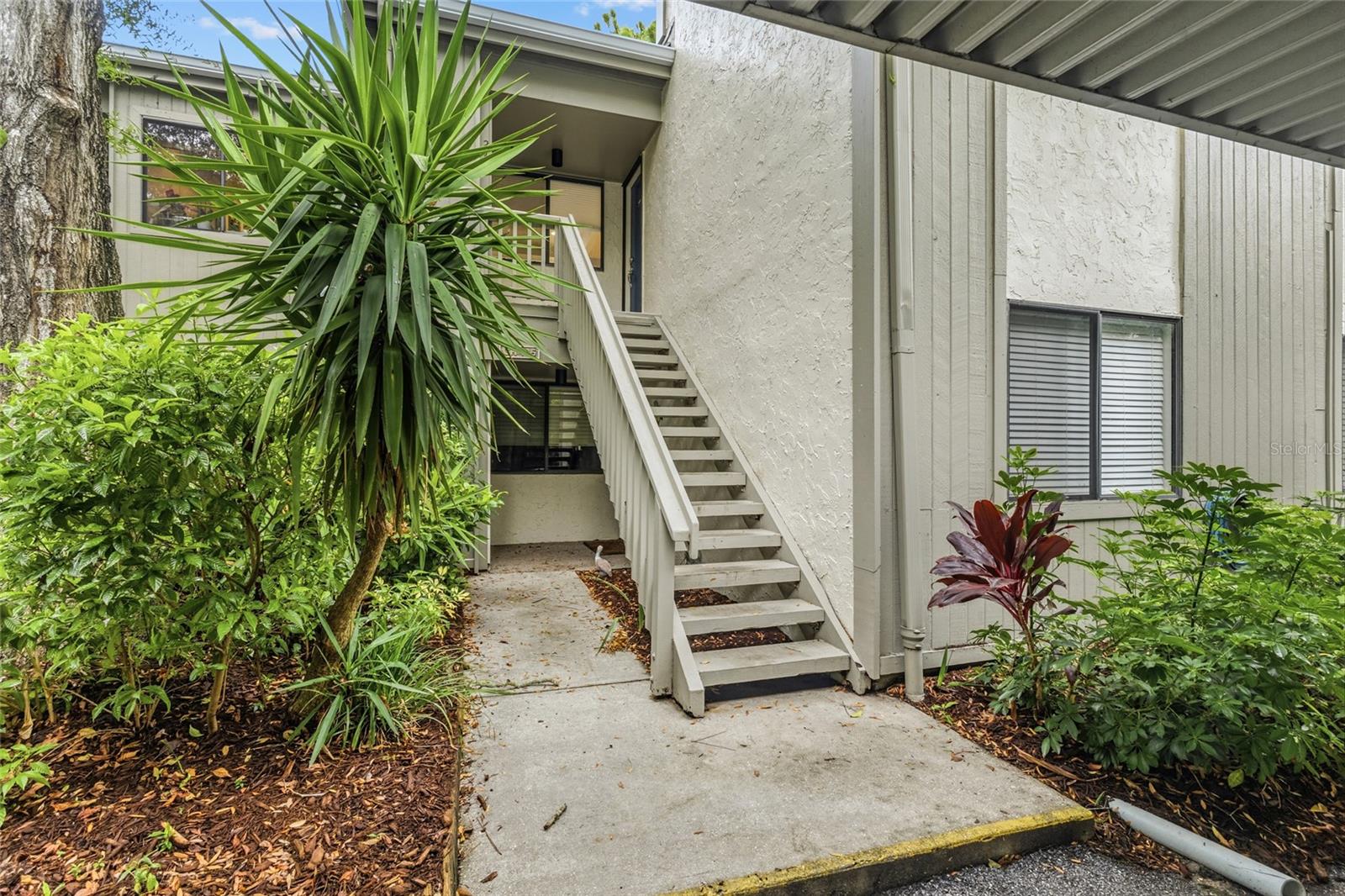 It's easy to enjoy the beauty of coastal waterfront living in Pelican Cove and this 3-bedroom end unit condo is centrally located within the complex. Everything in this condo is exquisitely done and no expense was spared with new flooring, new lighting, updated bathrooms, new kitchen with all new appliances, sink, lighting, counters and backsplash. Enjoy volume ceilings and the open floor plan that this three-bedroom unit provides. Pelican Cove is a magical place with lush landscaping that sits on gorgeous acres overlooking the Little Sarasota Bay. This is what Florida living is all about, stroll to the Pelican Point Observation deck, the bird sanctuary or the through the gardens. This community is a boaters dream with more than 87 boat harbor slips with each slip having water and electric. There are six heated pools to choose from, pickle ball, kayak and canoe launch and storage, gym, 4 lighted tennis courts, shuffleboard, basketball, 5 miles of amazing walking trails and Musical concerts. Pelican University offers classes and clubs for all including woodworking, photography, and clay sculpture, to name a few.