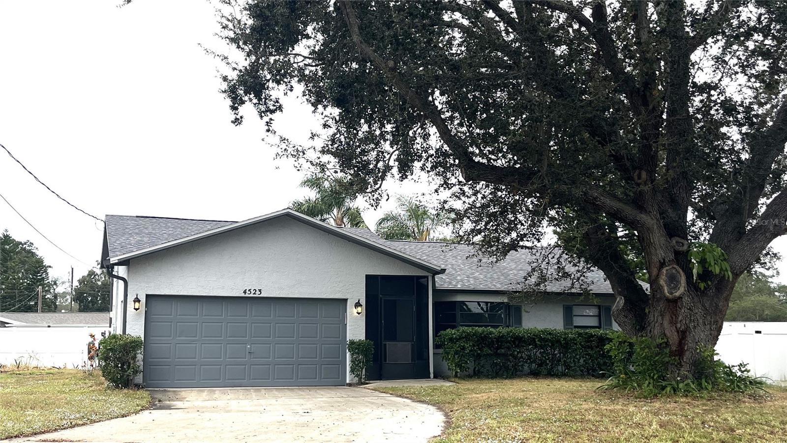 Plenty of room in your newly renovated home in Sarasota Springs with NO HOA! This 4 bedroom/3 bath/2 car garage home has a 4th bedroom/studio that can be an IN-LAW SUITE with private entrance, kitchenette and full bath!  It could also be an apartment to rent out for income!
Great neighborhood in the Bee Ridge/McIntosh area, with bridge to ride bike or walk to the Brentwood Elementary School. 
This home has been completely redone.  Brand New Roof Nov 2023!  New Skylight! Interior renovation 2022 with all new flooring and baseboards, interior all painted, kitchen has stone counters, new cabinets, new stainless-steel appliances!  New bathroom vanities!  New Fence along back! New ceilings, new fans, new hardware, new lighting, new blinds/window treatments, new toilets, garage painted w/ new baseboards, new garbage disposal! New exterior and interior doors!  AC is 2019! Water heater 2017! New gutters 2022! Exterior paint 2019!  Laundry area with laundry tub and plenty of parking space for RV or trailer in large side yard.