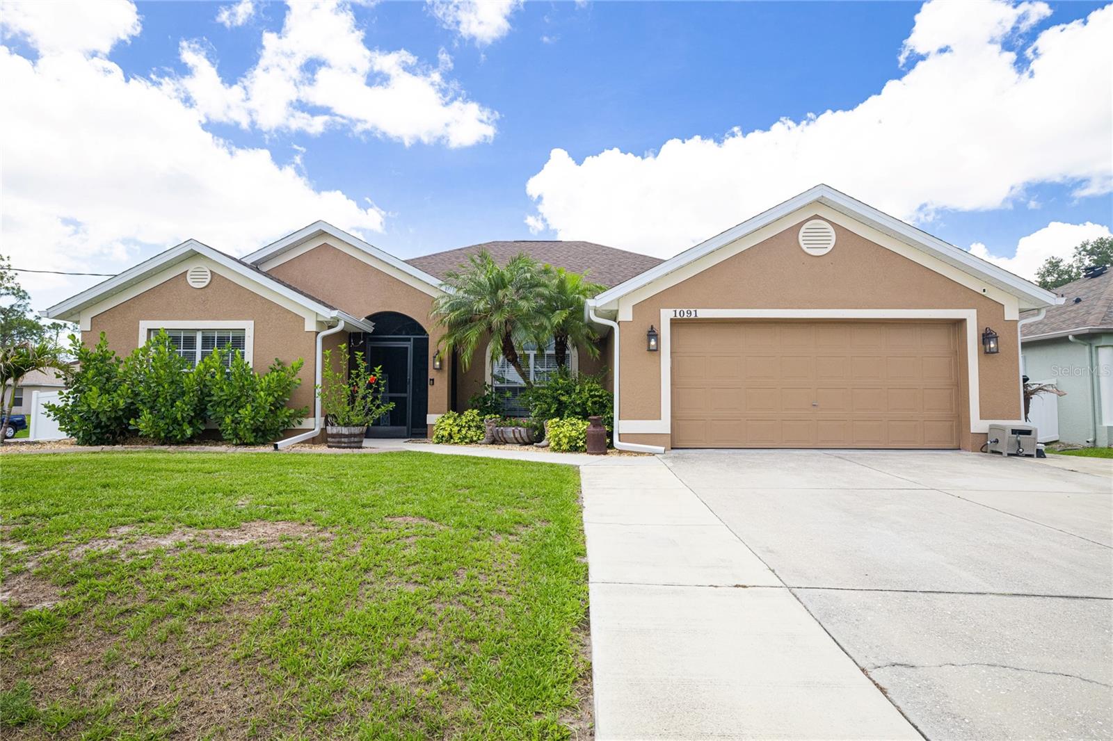 Don’t miss out on this incredible opportunity to own a beautifully updated saltwater pool home located in the highly desirable Toledo Blade area of North Port. Offering 4 bedrooms plus a private office/flex room currently being utilized as a 5th bedroom, 2 bathrooms, and a 2-car garage with an extended widened driveway, this meticulously maintained home sits on an oversized fenced corner lot in a quiet neighborhood just minutes from I-75, shopping, dining, schools, and everyday conveniences. From the moment you arrive, you will immediately notice the pride of ownership and attention to detail throughout this move-in ready home. Featuring a modern farmhouse-inspired interior, the home offers luxury vinyl plank flooring throughout, granite countertops in the kitchen and bathrooms, a beautifully remodeled kitchen, and an updated primary bathroom. The guest bathroom also features dual granite sinks and upgraded finishes. Major improvements provide peace of mind, including a roof replaced in 2022, attic insulation completely replaced in 2024, an updated septic system that was recently pumped, custom pavers that elevate the lanai and outdoor entertaining spaces, updated appliances installed in 2020, an updated pool pump installed in July 2022, and an updated A/C system installed in 2019. The interior and exterior of the home were repainted in 2022, creating a fresh and modern feel throughout. Additional features include a whole-house reverse osmosis system installed in 2021, epoxy-coated garage floors, 5-inch baseboards throughout, and a hot tub installed in 2021 for the ultimate backyard retreat experience. Step outside and enjoy your private backyard oasis complete with a sparkling saltwater pool, spacious outdoor entertaining areas, beautifully finished and new paver decking, and plenty of room to relax and enjoy the Florida lifestyle year-round. The storage shed and hot tub convey with the home. Conveniently located near Toledo Blade Elementary School and offering easy access to North Port, Port Charlotte, Wellen Park, shopping, dining, parks, Gulf beaches, and commuter routes, this property combines location, functionality, and extensive upgrades in one exceptional package. Schedule your private showing today and experience everything this beautifully maintained North Port pool home has to offer.
