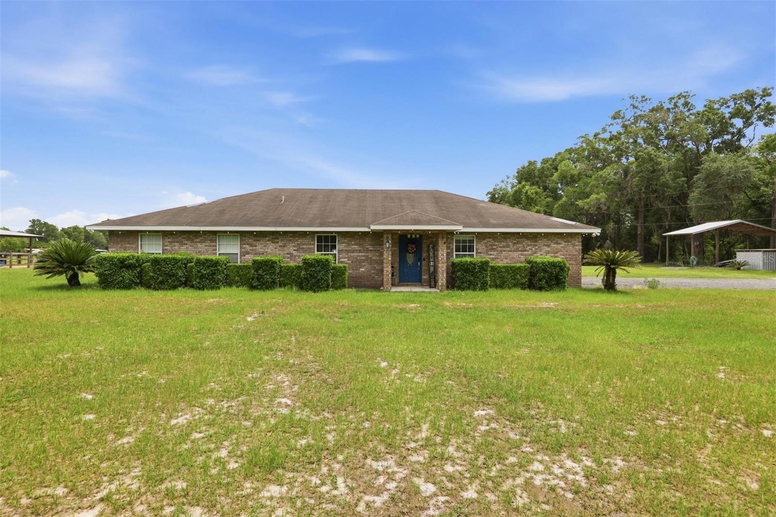 Welcome to this charming brick single-family home nestled on a sprawling five-acre lot in Trenton the heart of Gilchrist County, Florida. This 5-bedroom, 3- Full Bathrooms home also has an additional dwelling unit. Perfect for additional guests, rental, or living space for family, this additional livable home on the property offers buyer's a lot of potential. The home is well upgraded and includes an advanced water treatment system. The seller will also be installing a new roof on the home. 

The home conveys with a wonderful selection of furnishings including living room furniture, breakfast nook table, several bedroom sets, and an assortment of miscellaneous furniture, sofas, accessories, wall decor, and tables. Almost fully furnished and ready for a quick move. Seller can also remove furnishings if buyer desires. The interior layout is open and very functional with lots of light. The kitchen is well-appointed with a Stainless Steel appliances including oven, dishwasher, microwave, and refrigerator, and chest freezer.

The property is horse ready with a large barn, fully fenced, has paddocks with shelters. There is also a place to keep your camper with a full RV hook up.

One of the standout features of this property is the detached in-law suite, providing exceptional flexibility for multigenerational living, guest accommodations, or even potential rental income. A barn on the property adds further versatility for those with agricultural interests, hobby farming aspirations, or simply a need for additional storage and workspace. ADU is currently rented and tenant is fine with staying or vacating. 

Conveniently located along a paved county road with easy access to surrounding communities, this property offers the perfect blend of peaceful country living and everyday convenience. Whether the goal is a primary residence, a weekend retreat, or a multi-use rural property, this one checks all the boxes.

Custom water treatment system and water softener for high quality clear water. Water treatment system is covered from the elements in its own building. The seller to replace the Roof.