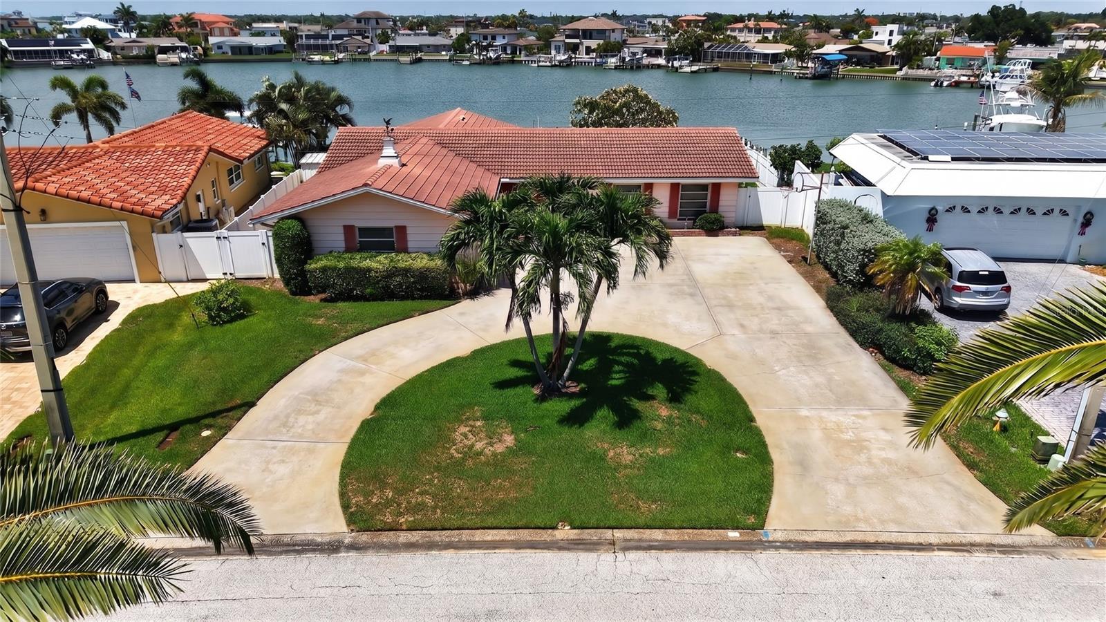 Welcome to coastal luxury in the highly sought-after Yacht Club Estates community of St. Petersburg. Perfectly positioned on protected deep water, this beautifully updated waterfront ranch offers a fantastic home and an exceptional boating lifestyle.

A circular driveway welcomes you home and provides ample parking in addition to the spacious two-car garage with plenty of storage. Inside, the home has been thoughtfully renovated with quality finishes throughout. Luxury vinyl plank flooring flows seamlessly through the main living areas, while the stunning new kitchen features custom cabinetry, beautiful stone countertops, and plenty of space for entertaining. Both bathrooms have been completely updated with modern finishes and stylish design.

The desirable split-bedroom floor plan offers privacy for family and guests, while the spacious primary suite includes a walk-in closet and peaceful waterfront views.

Step outside to your own backyard paradise. A paver patio surrounds the sparkling pool and creates the perfect setting for relaxing, entertaining, or simply enjoying the ever-changing waterfront scenery. Watch dolphins play and boats cruise by from your private oasis.

Boaters will appreciate the private dock and boat lift, providing quick access to the Intracoastal Waterway, John’s Pass, and the Gulf of Mexico. Whether you’re heading out for a day on the water or enjoying a sunset cruise, this location is hard to beat.

Yacht Club Estates is one of St. Petersburg’s most desirable waterfront neighborhoods, known for its deep-water canals, larger homesites, active community atmosphere, and convenient location just minutes from the Gulf beaches, downtown St. Petersburg, shopping, dining, and Tampa International Airport.

Located at 7957 10th Avenue South, this is more than a home, it’s a waterfront lifestyle. Schedule your private showing today.
