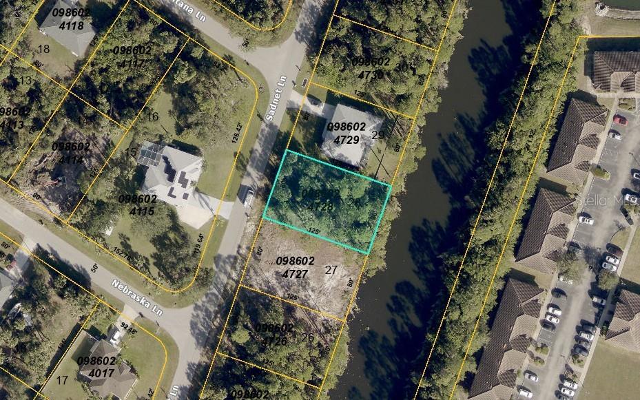 Beautiful Canal lot in a quiet yet central part of North Port. Large park like property across the street insures that there will be only one neighbor in the front. Nice and wide canal at the back insures privacy in the back yard. Lot is mostly in X flood zone with fringes along the canal being in AE flood designation. Convenient location to I-75 with exit being only 4 miles away. 2.5 miles to local Publix. Cocoplum shopping area is 5 miles. Seize this opportunity to build your dream home with no HOA and CDD expenses. Act now!