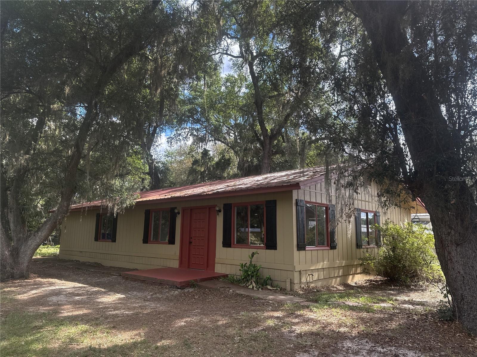 Welcome to this beautifully updated property in the heart of Ocklawaha. This move-in ready home features numerous recent upgrades including a new roof, HVAC system, water heater, flooring, fresh paint, updated vanities, and a remodeled kitchen. The main home offers comfortable living with modern finishes throughout, while the separate 2 bedroom, 1 bathroom mother-in-law suite has also been tastefully updated, making it ideal for extended family, guests, or additional flexibility. Situated on a fenced lot with a storage shed for extra space and convenience, this property offers endless potential. Conveniently located with easy access to Ocala, The Villages, lakes, and outdoor recreation. Schedule your showing today!