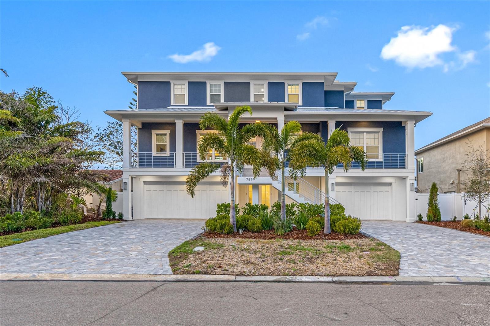 Seller is motivated! This extraordinary brand-new in 2024 home, offers unparalleled panoramic views of Boca Ciega Bay, the Park Street Mansions, and the Intracoastal Waterway from this perfectly situated property. Imagine waking up to the breathtaking sight of dolphins gracefully dancing in your backyard. Whether you have a dream boat to park on the lift or a deep-draft vessel to moor at the existing dock with electric and water access, this residence epitomizes waterfront living at its finest. This multi-story gem features 5 bedrooms, 3.5 baths, and an impressive 75' of water frontage and a whole-home generator. Car enthusiasts will appreciate the spacious 4-car garage, while everyone will delight in the convenience of an elevator, ensuring easy access to your desired floor without navigating the stairs. The open floor plan ensures that every room offers awe-inspiring water views. The kitchen is a culinary haven with Quartz counters, a stylish backsplash, custom cabinets, and top-of-the-line Monogram stainless appliances, including a striking waterfall island. The dining room features a
built-in bar and a stunning wine wall, leading to the custom designer-inspired fireplace wall and coffered ceilings in the great room. Luxury vinyl flooring and impact-resistant PGT windows enhance the allure of this home. Both the front and back balconies, with their magnificent water views, provide the perfect spots for relaxation. From the exquisite transitional tile and seamless glass showers to the beautifully crafted soaker tub and custom closet shelving, every aspect of this home has been thoughtfully designed, showcasing the finest materials and craftsmanship available. Another exciting feature is that the first floor has been wired for potential additional living space, and the back balcony has been preplumbed and wired for a future outdoor kitchen, offering endless customization possibilities for the new owner. Additionally, a new seawall ensures peace of mind. Ideal for those seeking island living, boating, quick access to the beach, downtown St. Pete, and the Interstate. Don't miss out on this rare opportunity. In today's fast-paced real estate market, properties of this caliber are in high demand and don't remain available for long. Seize this chance to secure your slice of luxury living on Boca Ciega Bay!