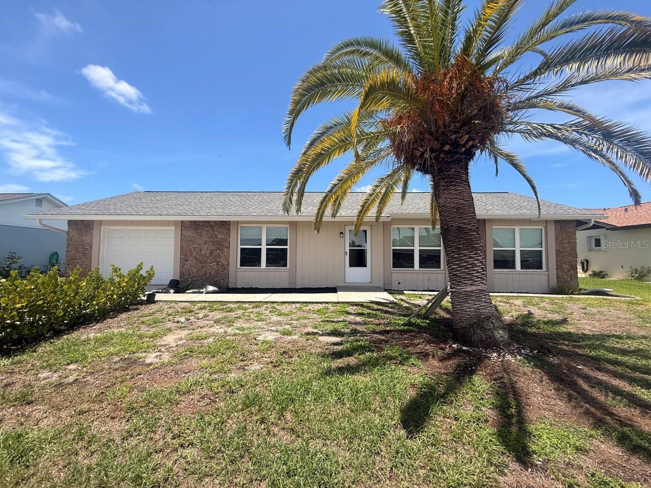 Welcome to easy Florida living! Nestled on a picturesque freshwater canal in the desirable South Gulf Cove area of Port Charlotte, this beautifully maintained 3-bedroom, 2-bath home offers the perfect combination of comfort, functionality, and waterfront serenity.

Step inside to discover an open, light-filled floor plan with soaring ceilings and updated luxury vinyl plank flooring throughout the main living areas. The spacious living and dining rooms flow seamlessly into the kitchen, creating an inviting space for everyday living and entertaining. A split-bedroom layout provides privacy for both owners and guests, while the indoor laundry room adds everyday convenience.

The true highlight of this home is the oversized screened lanai overlooking the peaceful canal—an ideal place to enjoy your morning coffee, unwind after a day on the water, or simply soak in the beautiful Florida sunsets. The generous backyard offers plenty of room to add a pool, create your dream outdoor living space, or simply enjoy the waterfront setting.

Additional features include a two-car garage, public utilities, mature landscaping with stately palm trees, and a well-maintained interior that is truly move-in ready.

Located just minutes from boating, fishing, golf courses, restaurants, shopping, beautiful Gulf beaches, and everything Southwest Florida has to offer, this home provides the perfect opportunity to enjoy the Florida lifestyle year-round.

Whether you're searching for your primary residence, seasonal retreat, or investment property, 13569 Overton Avenue is ready to welcome you home.