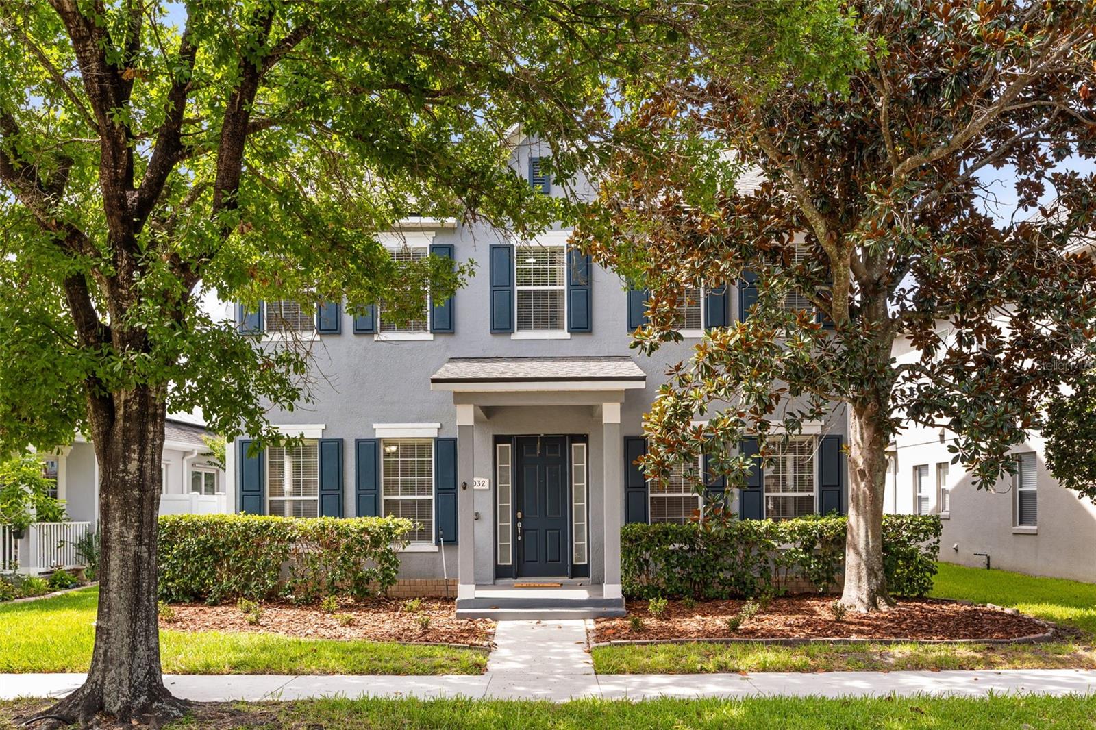 Imagine living where everything you love is just a short walk away. Welcome to 5032 Beach River in Windermere's beloved Summerport community. This move-in ready 4-bedroom, 2.5-bath home offers a lifestyle that's hard to find and even harder to leave. Start your mornings with a stroll to Foxtail Coffee, cool off with an afternoon treat from Kelly's Homemade Ice Cream, walk to highly sought-after Keene's Crossing Elementary, or spend evenings enjoying Summerport's parks, playgrounds, fishing dock, community center and so much more—all just minutes from your front door. Nestled beneath mature trees that create a picturesque streetscape and added privacy, this home welcomes you with timeless curb appeal and a rear-loaded garage complemented by an extended driveway—providing plenty of parking for family and guests. Inside, you'll find a well-maintained home with recently refreshed kitchen, a functional layout, and peace of mind with a new roof installed in 2025. Step outside to the oversized screened-in patio, a true extension of the living space with endless potential for entertaining, outdoor dining, game days, or simply relaxing and enjoying Florida's beautiful weather year-round. With unmatched walkability, exceptional community amenities, and a prime Windermere location, this is more than a home—it's the lifestyle you've been waiting for.
