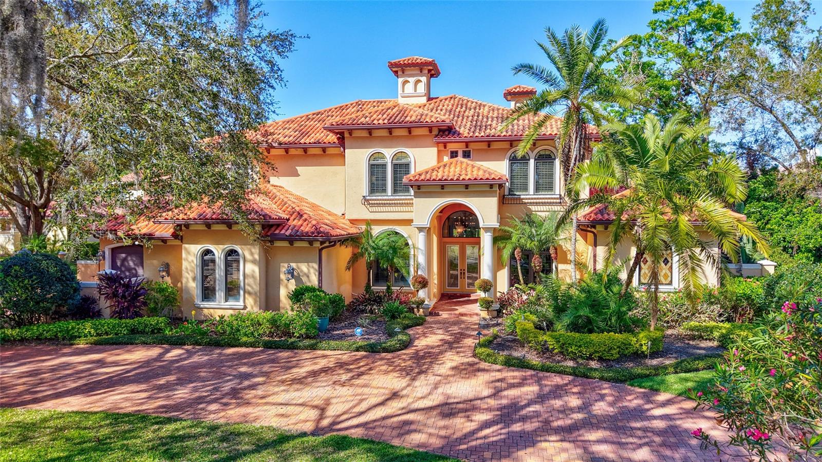 Possibly one of the BEST streets in the A+++ community of AVILA, premier 24-hour gated golf and country club community in Tampa.  Tranquil street with only a handful of homes near the cul-de-sac offers its residents a safe and peaceful lifestyle.  The home itself is ABSOLUTELY AMAZING!  Built by the high-end custom builder Campagna Homes, no detail was overlooked in this home. 4-car garage with lots of extra space for additional cars in the courtyard and also on the oversized circular driveway adds so much functionality. The most grand foyer with high ceilings, amazing iron-cast staircase, the green outdoors and pool area that you see immediately upon your entrance, the most beautiful and elegant area around the fireplace - you immediately feel it must be something special.  Primary bedroom DOWNSTAIRS, completely away from all other bedrooms. Smart and extremely well thought-out floor plan offers all the right rooms and spaces.  Office near the primary bedroom, so many amazing areas for family gatherings and entertainment of guests.  It is spacious, light and bright. AN OFFICE in front of the house, away from other more busy areas, so you can attend to your business without distractions. COMPLETELY remodeled kitchen, featuring contemporary cabinetry and island with the accent color. Everything is so elegant and tasteful.  On the other side, you will find the coffee nook with your favorite mugs and coffee equipment for your morning coffee indulgence.  Thermador appliances.  2 built-in refrigerators, 6-burner range, double-oven, lots of cabinet space and a walk-in pantry.  The butler pantry is nestled between the kitchen and the dining room. On the other side of the kitchen you will find the billiard room, with the wet bar and a powder room.  Theater room fully equipped with the projector and theater-seating.  There are 3 fireplaces in this home – in the living room, primary bedroom, and another one between the family room and the billiard room.  All other bedrooms (3) are located on the second floor.  One with the en-suite bath and 2 others sharing a Jack-and-Jill bathroom. The bonus room nearby is a great space and offers so many possibilities!!! A great space that can be a yoga room, a play room, another TV room!  YOUR TEENAGERS will never want to leave the house - this is such a great gathering space!  YES, this home offers it all.  SO MANY possibilities! INCREDIBLE serene and private outdoor oasis awaits outside. Outdoor kitchen, covered and open areas.  Large fenced-in yard. Come, fall in love, make it your home…