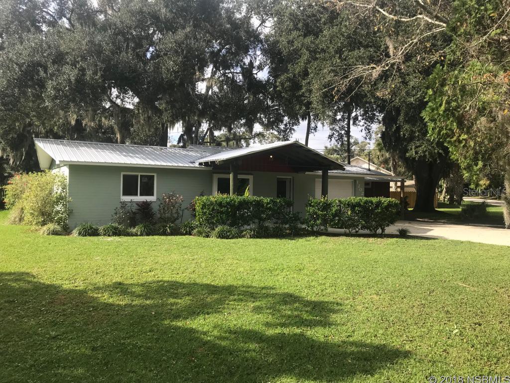 Custom home extensively remodeled by Southern Structures. This beautiful home is situated in a convenient area of Florida Shores on a large corner lot and is shaded by large oak trees. This comprehensive remodel which has made the home both eclectic and warm was completed in 2012. The philosophy behind the project was to create a home with low maintenance costs while utilizing reclaimed and re-purposed materials. The home features stained terrazzo and concrete floors, a metal roof, custom made vaulted ceilings with exposed trusses, and a wet bar. The house is trimmed throughout with reclaimed wood, the kitchen is custom made with hand-distressed cabinets and many of the light fixtures through-out the house were hand made from re-purposed materials. The home also features custom interior doors, spray-foam insulation, and a tank-less propane powered hot water heater. You can entertain with ease as the exterior of the home features a large front porch and a rear deck from which to enjoy the large backyard. This home has many custom features which are not easily replicated and must be seen to truly appreciate the level of detail and craftsmanship. ;Water: City