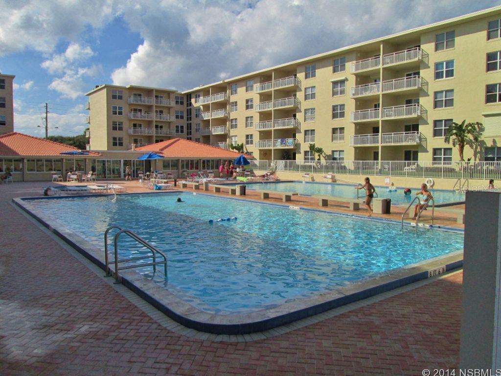 Sought after ground floor Sea Coast Gardens III condo overlooking pool area with ocean views from master bedroom & private, paver patio, in the popular, trendy & quaint seaside community of New Smyrna Beach. Onsite property management makes this condo perfect for seasonal/vacation/investment use or just enjoy year round living in Floridaâs sunshine.  Savor cooling ocean breezes, while sipping your morning coffee or imbibing in your favorite cocktail or soft drink on your private patio or while playing shuffleboard on one of the 2 shuffleboard courts or take walks or bike on the no-drive beach.  Sunbathe on the spacious pool deck then cool off in one of 2, sparkling Olympic-sized pools, one heated seasonally & 2 wading pools.  Well-kept 2 bedroom, 2 bath condo features newer white kitchen cabinetry & bathroom cabinetry, extra closet space in master bedroom, mirrored closet doors & is being sold fully furnished (except one desk) ready for your immediate enjoyment or rental. First floor location provides easy access to pool, clubhouse, lawn, beach & unloading groceries. Beautiful paver walkways. One designated parking space, plus 3 extra parking passes.  Pet friendly condo.   $406.39 monthly condo fee currently covers cable TV with HD box & 2 digital adapters, clubhouse, pool, lawn, common areas, signage, master condo insurance, administrative fees, water, sewer & trash.  2 coin-operated laundry facilities on each floor.  A portion of condo fees are being set aside in an effort fully fund condominium reserves.  Donât miss your opportunity to own your own affordable piece of beachfront paradise. ;Water: City
