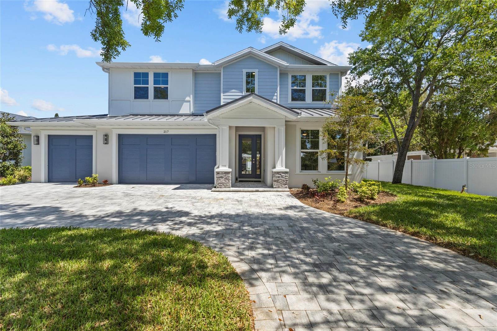 Introducing THE RETREAT, a stunning two-story residence.  FOUR (4) bedroom, THREE (3) bath.   Paver driveway, 3 CAR GARAGE, LVP flooring.  Home has been professionally staged.  Pool is complete; size 12 x 26 , leaving plenty of green space for pets in the backyard!   This exceptional new build boasts superior block construction, a durable metal roof, impact-resistant windows, doors, and sliders.  Inside is a thoughtfully designed open floor plan, featuring soaring 10-foot ceilings and elegant 8-foot solid core doors that enhance the home’s impressiveness.  The gourmet kitchen is complete with a 6-foot island, luxurious quartz countertops, custom shaker cabinetry, and a top-of-the-line appliance package, perfect for both daily meals and entertaining.  
The primary bedroom, located on the main level, is a serene retreat with stunning tray ceilings, large his/her walk-in closets, double vanity, and a spacious walk-in shower.  Bedroom #2, also on the first floor, is versatile and can serve as an additional bedroom or a home office. Upstairs, you'll find two more generously sized bedrooms that share a beautifully appointed full bathroom.
The home’s detailed interior is complemented by luxury vinyl plank flooring throughout both levels, providing durability and style. Outdoors, a gas-heated saltwater pool and paver deck creates the ideal setting for relaxation and entertainment.    Conveniently located with easy access to downtown Sarasota, the Legacy Trail, Payne Park, Sarasota Memorial Hospital, and the world-renowned beaches of Longboat and Siesta Keys, this home offers the perfect blend of luxury, comfort, and convenience for modern family living.    Experience elevated living at its finest in "your RETREAT"!