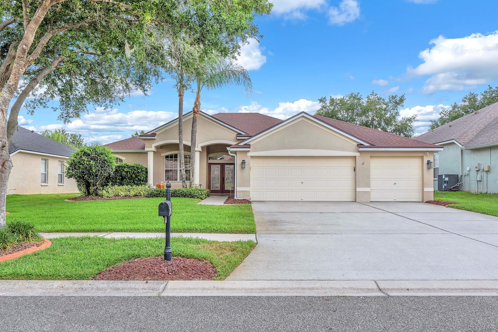 Welcome to this beautifully maintained home located in the desirable Trails at Durant community in Dover. Offering 4 bedrooms, 3 full bathrooms, a 3-car garage, a sparkling pool and spa, and 2,564 square feet of thoughtfully designed living space, this home combines comfort, functionality, and inviting indoor-outdoor living.
Formal living and dining rooms flank the entry, creating welcoming spaces for entertaining and everyday gatherings. At the heart of the home, the open concept great room seamlessly connects the family room, kitchen, and dinette, all accented with crown molding and designed for easy flow. The kitchen features granite countertops, stainless steel appliances, ample cabinet space, and a pantry closet. Wood-look ceramic tile extends throughout the main living areas, while the bedrooms offer the comfort of carpet.
The split bedroom floor plan provides added privacy for the primary suite, which is tucked away on one side of the home. This spacious retreat includes an extended sitting area, a large walk-in closet, and an en-suite bathroom complete with a garden tub, separate glass-enclosed shower, and split vanities. Bedrooms two and three are located on the opposite side of the home and share access to a full bathroom. Bedroom four is oversized and offers its own en-suite bathroom with a tub/shower combination, making it ideal for guests, multigenerational living, or a private second primary suite.
Step outside to enjoy your own backyard oasis featuring a screened lanai, PebbleTec pool and spa, and a fully equipped outdoor kitchen with a grill and refrigerator—perfect for relaxing or entertaining year-round. Additional highlights include solar panels, a roof replaced in January 2021, and an HVAC system replaced in 2024.
Conveniently located less than 1.5 miles from the elementary and middle schools, this home also offers a short drive to the heart of Brandon with an abundance of shopping, dining, and entertainment options. Commuters will appreciate the quick access to the Selmon Expressway, I-75, and Brandon Boulevard, making travel throughout the Tampa Bay area convenient and efficient.