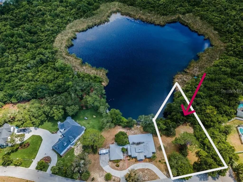 Discover the perfect setting to build your dream home on this gorgeous 1/3 acre lakefront lot tucked away on a secluded street in the heart of Tarpon Springs! Enjoy breathtaking open water views of Hidden Lake and the peaceful atmosphere this rare property offers with NO HOA restrictions. Just down the street from beautiful Sunset Beach, Fred Howard Park & Beach, and the scenic Spring Bayou, this location combines natural beauty with the best of the Florida lifestyle. Tarpon Springs is known for its famous Sponge Docks, historic downtown, charming boutiques, delicious restaurants, festivals, waterfront parks, and the popular Pinellas Trail. Whether you envision a luxury coastal retreat, vacation getaway, or year-round residence, this exceptional homesite offers endless possibilities in one of Florida’s most unique and vibrant communities.

Lot to be divided upon accepted contract. Property is currently part of 1103 Ashland Ave. Vacant Lots 35 & 36 to be separated prior to closing.