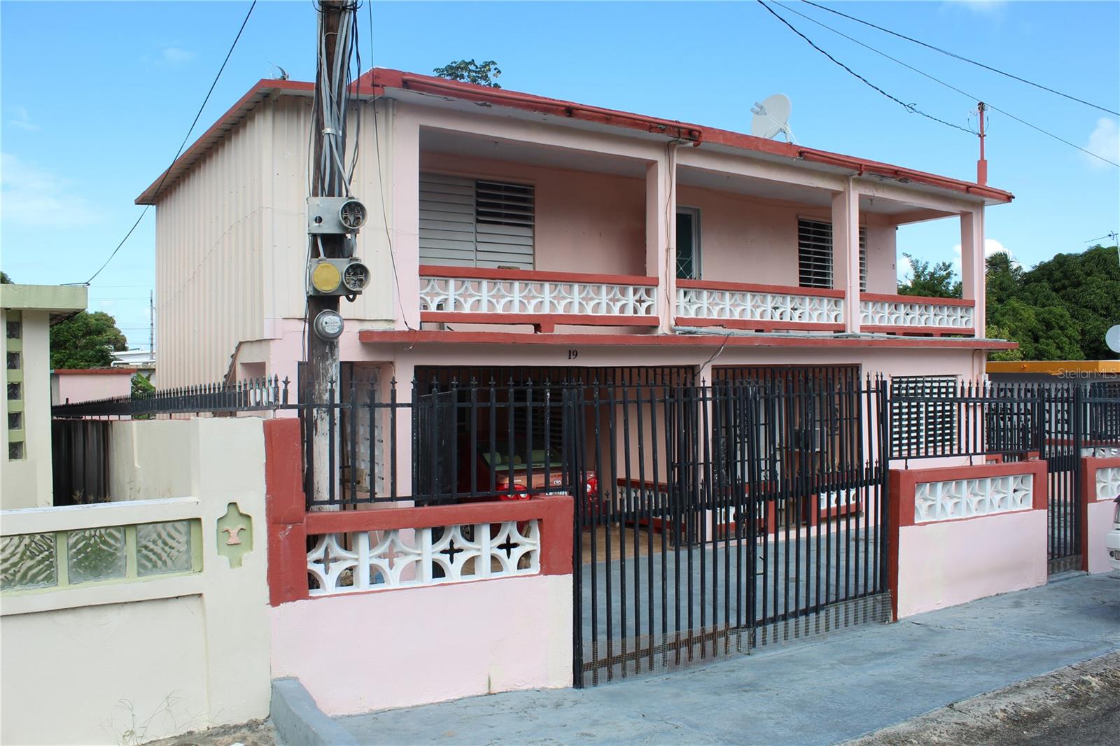 Welcome to Casa de Emma, a spacious island home, well-priced opportunity in a the peaceful neighborhood of  barrio Florida on Vieques Island.  This solid concrete home offers space, comfort, and versatility - perfect for a large family, extended guest accommodations,  or creative use as an income-producing property.  The layout is perfect for a Bed and Breakfast or adding a kitchen to the second level would create two separate homes.

This generous two-story residence features six bedrooms. two full bathrooms, and two living rooms, allowing ample separation of space for privacy or multi-generational living.  The large kitchen is ideal for cooking, gathering, and entertaining.

Casa de Emma sits on a quiet street with a large, backyard with some herbs, bananas  and room to plant more.   There is an outdoor built in grill and a sink,  a water cistern, and two out buildings with one housing the laundry.  Additionally there is a secure carport that doubles as a wonderful covered out door patio.

 There is a private staircase leading to the second floor as well as a staircase leading to the second floor rooftop, where there are views of the Atlantic ocean, the main island of Puerto Rico and peaks of El Yunque Tropical Rainforest.

Solid Concrete Construction

Solar Hot Water Heater

6 bedrooms/ 2 bathrooms

Two full living rooms 

Balconies on each floor capturing the Trade Winds

Large Kitchen

Large back yard

Rooftop with views

Centrally located neighborhood

Excellent price and value for its size

Casa de Emma is a great opportunity for those seeking peace, space and the conveniences of a central location.  With it's solid build, large spaces, inspiring rooftop views, this property is filled with potential - and ready for its next chapter.