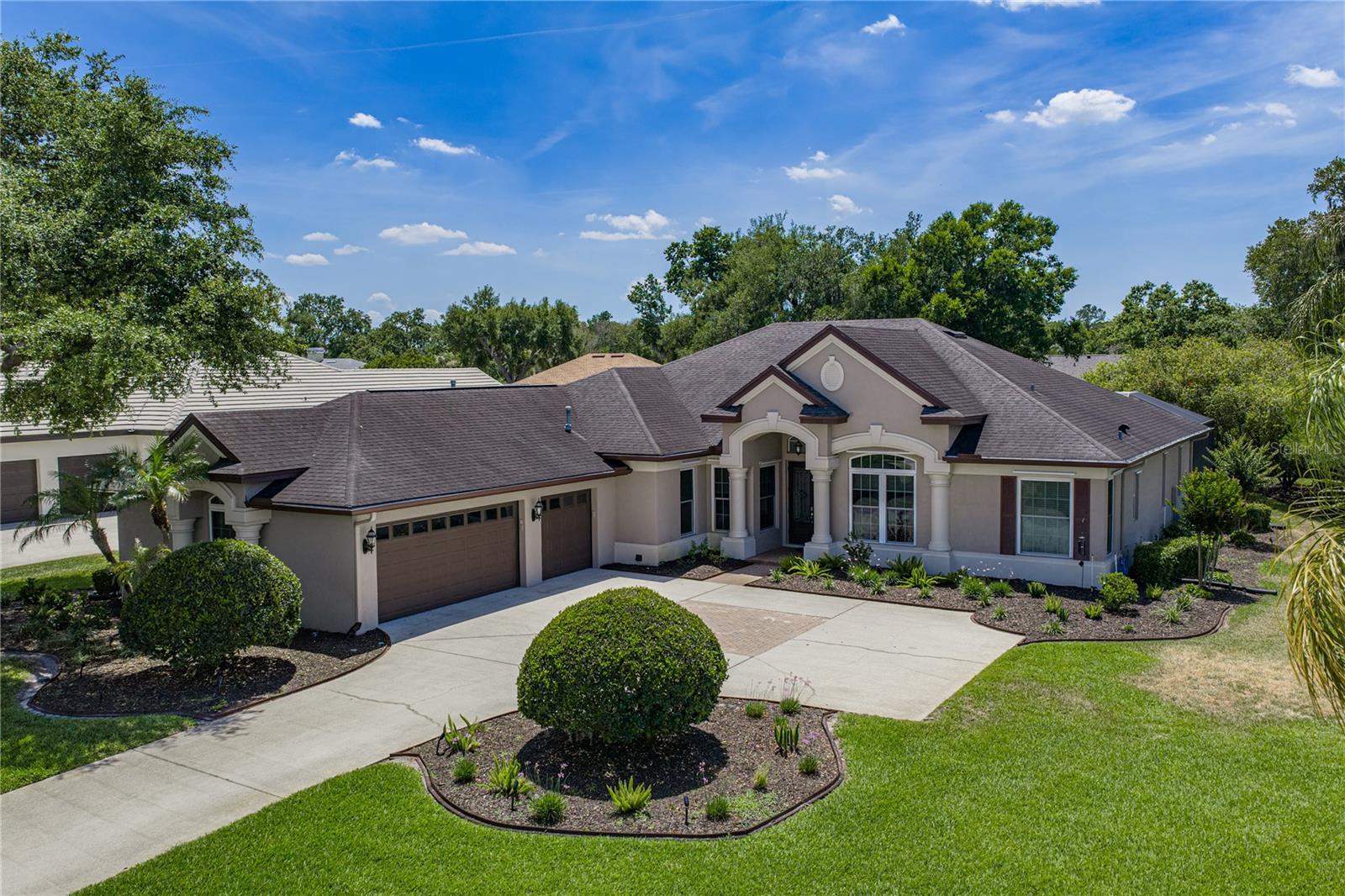 Experience the perfect blend of architectural elegance and modern peace of mind in this custom-built Arthur Rutenberg estate. Situated on a sprawling .53-acre lushly landscaped corner lot, this meticulously maintained, home offers 3,162 sq. ft. of  living space within the exclusive 24hr guard-gated community of Fish Hawk Trails.  THIS IS AN ARCHITECTURAL MASTERPIECE! 
Step through the grand double-door entrance into a foyer that sets the stage for the rest of the home. You’ll be greeted by soaring volume ceilings, extensive crown molding, and a variety of designer ceiling treatments including tray, coffered, and cathedral styles. The interior is a showcase of craftsmanship, featuring elegant arches, stately columns, and built-in art niches.  The kitchen is a CHEF'S DREAM!! This open kitchen designed perfect for entertaining. It features premium granite countertops, a massive island with a single sink, stainless steel appliances, tile backsplash, and a walk-in pantry. For those working from home, a dedicated office/den provides the perfect quiet space.  Enjoy your morning coffee in the breakfast nook, where mitered glass windows provide an unobstructed view of your private poolside oasis. Amenities: COMMUNITY & LIFESTYLE Fish Hawk Trails offers a resort lifestyle with tennis and pickleball courts, a clubhouse, soccer fields, and nature preserves, Community Parks, Pavilion, Playground, 7 Miles of Nature Walking Trails. THINK OF IT AS A PRIVATE RETREAT! The 3-way split floor plan ensures maximum privacy. The primary suite is a sanctuary featuring rich wood flooring, a cozy sitting area, and a spa-like bath with a newly upgraded shower, garden tub, and dual vanities. Benefit from Low HOA fees and A-rated schools. you have to see ths one to take all the beauty in!!
EXTENSIVE UPGRADES & PEACE OF MIND ($100K+ INVESTED)
This home has been mechanically and structurally enhanced for longevity and safety-
POWER: Generac Whole-House Generator with remaining warranty.
HVAC:  Trane AC installed (2020) on the garage the handlers,inspected yearly &  Hot Water Heater (2024). 
IRRIGATION: Sprinklers/Rancho Irrigation systems installed 2023
POOL: DEPTH; 3-61/2 (2023) pool pump replaced, upgraded pool lighting, and custom pavers. Resurfaced and tiled 
SAFETY: Storm shutters (original + 2024 additions) and gutter guards. 
Garage doors replaced : 2019
LUXURY FINISHES: 2026 New interior paint.
Flooring enhancements, and fully upgraded bathrooms.
This is a rare opportunity to own, a "ready to move in" gem in one of Lithia’s most desirable communities. Schedule your private tour today before its gone!