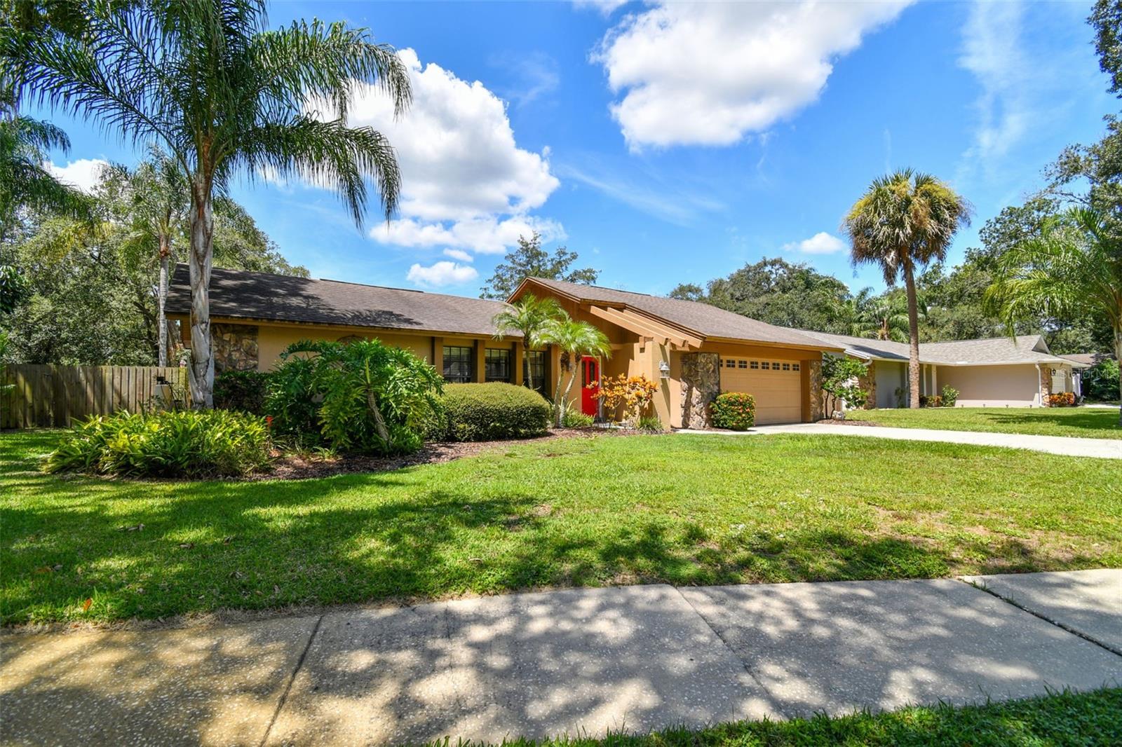 **BRAND NEW ROOF AND ELECTRICAL PANEL INSTALLED OCTOBER 2023!!**

Serenity and nature meets convenience in this rare gem of a home in the highly sought-after community of Rustic Oaks! This exquisite 4-bedroom, 2-bathroom residence with a pool and two-car garage offers the perfect blend of comfort and luxury.

As you step inside, you'll be greeted by a desirable split floor plan that maximizes both privacy and functionality. The primary suite is a true retreat, boasting picturesque views of the sparkling pool and featuring an updated en-suite bathroom that adds a touch of elegance to your daily routine.

This home is designed for entertainment, with a spacious living room and dining room area towards the front of the house. As you continue through the home, you'll discover a generously sized kitchen with ample counter space and storage, seamlessly overlooking the cozy family room. Plus, you'll enjoy easy access to the inviting pool and lanai area, perfect for outdoor gatherings and relaxation.

The three additional bedrooms and guest bathroom are tucked away in a separate hallway off the family room, providing plenty of space for family and guests. 

But the real magic happens outside! Your outdoor living space is truly one-of-a-kind, featuring a pavered and screened-in lanai, a heated pool and spa, and an expansive park-like backyard that offers unparalleled privacy. Finding a lot of this size is a rare gem in Pinellas County and an almost impossible find in Palm Harbor.

Rustic Oaks is not only a picturesque community but also conveniently surrounded by sought-after schools, beautiful beaches, shopping, and easy access to airports. Here, you can enjoy peace and tranquility without sacrificing the excitement and convenience of the area.

Don't miss this opportunity to make this exceptional Rustic Oaks residence your forever home! 

Flood insurance not required, measurements are approximate.