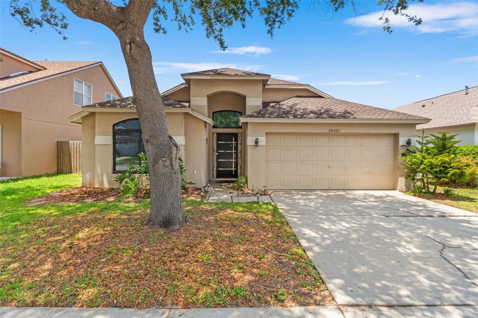 Tucked away on a peaceful tree-lined street in the heart of Lutz, this fully renovated 4-bedroom, 2-bath pool home in Oak Grove is the definition of modern luxury living. Offering the perfect blend of high-end design, comfort, and investment potential, this one-of-a-kind property can be sold completely turn-key furnished and has already proven itself as a successful Airbnb. Whether you’re searching for a dream primary residence, vacation retreat, or income-producing investment, this home is ready to impress from day one. Inside, every detail has been thoughtfully curated with sleek European-inspired finishes, custom millwork, designer moldings, solid-core doors, and striking black ceramic tile flooring throughout. The showpiece kitchen was designed for both beauty and function, featuring Cambria quartz countertops, an oversized island, JennAir stainless steel appliances, a Bosch dishwasher, wine refrigerator, appliance garage, and custom storage solutions that elevate everyday living.The private primary suite feels like a luxury resort, complete with vaulted ceilings, a spacious walk-in closet, and a stunning spa-style wet room bathroom featuring a soaking tub, walk-in shower, tiled walls, LED mirrors, and dual sinks. Three additional bedrooms offer flexibility for guests, family, or a home office setup.Step outside to your own private Florida oasis where a screened lanai, sparkling pool, and pergola create the ultimate space for entertaining or relaxing year-round. With major upgrades already completed — including a new roof in 2022, updated pool equipment, Culligan water softener system, and under-sink filtration — this home delivers peace of mind along with exceptional style.Located near top-rated schools, shopping, dining, and major roadways, this rare Oak Grove gem offers luxury living with endless possibilities. Homes like this rarely hit the market — schedule your private showing today.