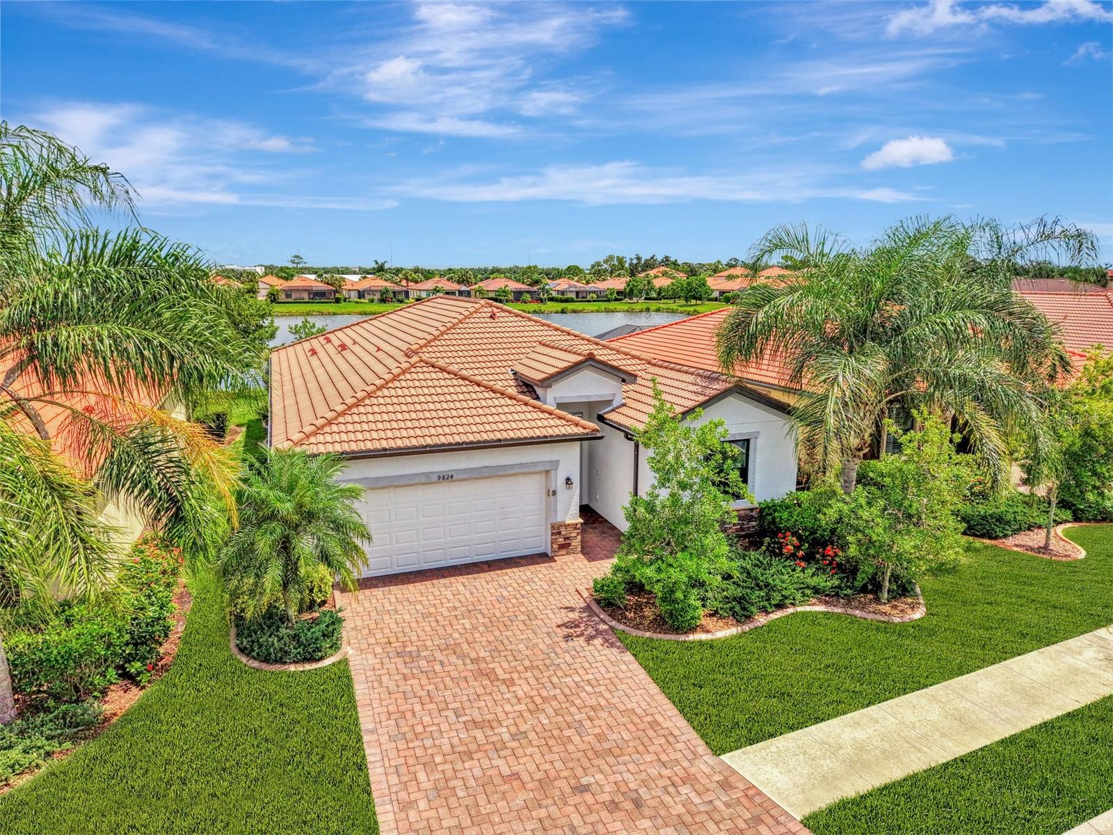 Virtually Staged. Exceptional care and pride of ownership are evident throughout this beautifully maintained, move-in-ready residence, offering 4 Bedrooms, 3 Bathrooms, and 2,025 square feet of living space. An outstanding value, located in a vibrant maintenance-free community with LOW HOA fees and NO CDD fees. Perfectly designed for comfort, privacy, and peace of mind. Enjoy a premium lot with stunning WATER view, rich in abundant wildlife. Crafted for Florida living, this home features IMPACT-Resistant Windows and Doors throughout, providing exceptional storm protection, enhanced security, energy efficiency, and year-round peace of mind. The split floor plan features two Bedrooms on one side of the home with an adjacent Guest Bath. A second En suite Bedroom is located on the other side of the home and elevated by a premium Kohler Hydrotherapy Tub, creating a spa inspired retreat designed for relaxation and rejuvenation. The Primary Suite is thoughtfully appointed as a private haven of comfort and serenity. enhanced by two Walk-In Closets with extra shelving and a luxurious En suite with dual sinks, soaking tub and separate shower. The Great Room with sliding glass doors flows to the Dining area and gourmet Kitchen featuring granite countertops, stainless steel appliances, large Single-Bowl Sink, island, abundant cabinetry with crown, pots & pans drawer, and Walk-In Pantry. The interior laundry room offers practical convenience with direct access to the garage offering epoxy flooring and a hurricane rated garage door. Watercrest is a gated community where your HOA Fee includes your Lawn Care, Trimming of Landscaping, Irrigation, Community Pool, Fitness Center, and Bocce Ball. Excellent location, less than 5 miles to Downtown Venice pristine Beaches, fine Dining, Shopping, Legacy Trail and the Venice Theatre. Near Grocery Stores, Medical Offices, and Sarasota Memorial Hospital.  Schedule your showing today and fall in love with your new home!