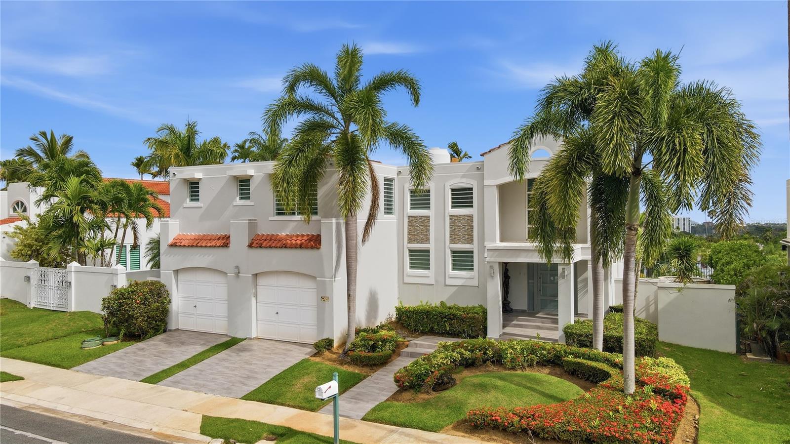 Welcome to one of the most exclusive residences currently available in Montehiedra.

This is not simply a home—it’s a private resort in the heart of San Juan.

Positioned on one of the community’s most desirable streets, this residence enjoys spectacular city views, exceptional privacy, and over 4,000 square feet of living space designed for both luxury living and entertaining.

As you arrive, you’re immediately welcomed by a grand entrance, elegant living areas, and seamless indoor-outdoor flow that defines luxury Caribbean living.

The outdoor terrace is truly the centerpiece of the property. Imagine hosting family gatherings, executive events, or sunset cocktails while enjoying a resort-style pool, jacuzzi, full outdoor bar, dining area, and even your own private basketball court.

Inside, the home offers multiple entertaining spaces, a beautifully remodeled kitchen with an oversized island, formal and informal dining areas, and spacious family rooms designed for comfort and sophistication.

One of my favorite features is the versatile bonus room. Whether you envision a state-of-the-art golf simulator, private gym, movie theater, wellness spa, yoga studio, or executive office, this space adapts perfectly to your lifestyle.

Upstairs, the primary suite delivers the luxury experience today’s buyers expect, featuring generous living space, a walk-in closet, spa-inspired bathroom with jacuzzi, and private access to additional living areas.

The property also includes a 20-kilowatt power generator, water cistern, water filtration system, and softener—providing peace of mind and uninterrupted comfort year-round.

Beyond the home itself, Montehiedra offers 24-hour security, a community clubhouse, swimming pool, fitness center, playgrounds, and one of the best residential environments in Puerto Rico.

Properties of this caliber, in this location, rarely become available.

For the discerning buyer seeking privacy, luxury, security, and an exceptional lifestyle, this residence represents a truly unique opportunity.


Let’s schedule your private tour today.”