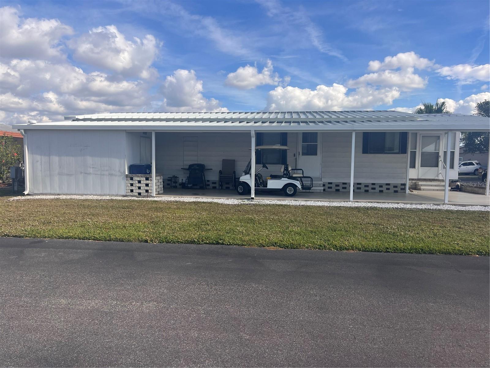 Ready to move into 2 bedroom 2 bath furnished mobile home in a very nice park. Attractive laminate flooring through out for easy care. Open floor plan for the living room, dining room and kitchen. Enclosed lanai with hurricane shutters. Video on premises. Covered carport and work shop/ utility room with washer and dryer and a laundry tub. Westwinds is a very nice community with a large clubhouse and heated community pool. Conveniently located close to shopping , restaurants and I 75. The local air port and Bradenton and Sarasota are close by. Make your appointment to see today.