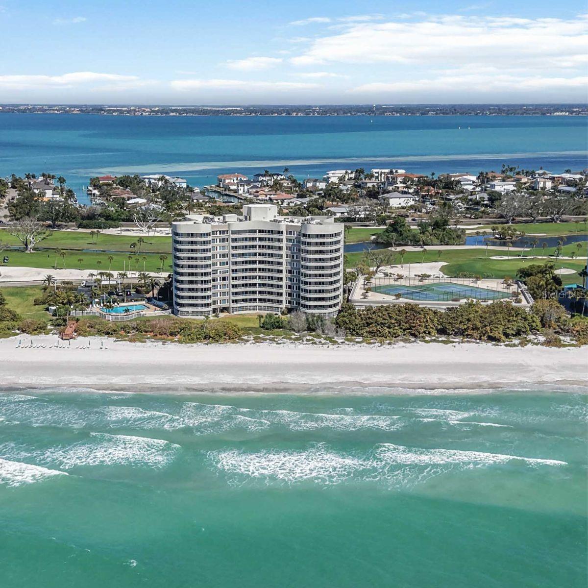 Discover Coastal Elegance at The Beaches of Longboat Key! Nestled behind the renowned gated entrance of the Longboat Key Club, The Beaches offers an unparalleled Gulf-front retreat on one of Florida's most exclusive barrier islands. This stunning 4th-floor, 2-bedroom/2-bath residence boasts direct western exposure, delivering breathtaking, forever Gulf of Mexico views and spectacular sunsets that paint the sky in vibrant hues every evening. Step inside to find stylish, move-in-ready finishes, including brand-new porcelain tile flooring throughout the living areas and elegant marble in both bathrooms. The updated kitchen shines with fresh cabinetry, a new GE Profile refrigerator, and dishwasher—perfect for effortless entertaining or quiet evenings at home. The spacious living room and both bedrooms feature impact-resistant sliders that open to a private balcony, seamlessly blending indoor comfort with the soothing sights and sounds of the beach and surf just steps away. Residents enjoy an exceptional array of resort-style amenities: 24-hour concierge service for added security and convenience, Gulfside heated pool and spa, Modern fitness center, Two Har-Tru tennis courts, Social room with a full catering kitchen, Direct beach walkway with complimentary beach chairs (and often umbrellas) provided. Additional perks include two assigned parking spaces in the secure garage and a dedicated storage unit. Priced to impress in this highly sought-after community, this turnkey condo combines modern luxury, prime beachfront access, and the prestige of Longboat Key Club living—without requiring club membership. Opportunities like this rarely last long on Longboat Key. Don't miss your chance to own a slice of paradise—schedule your private showing today!