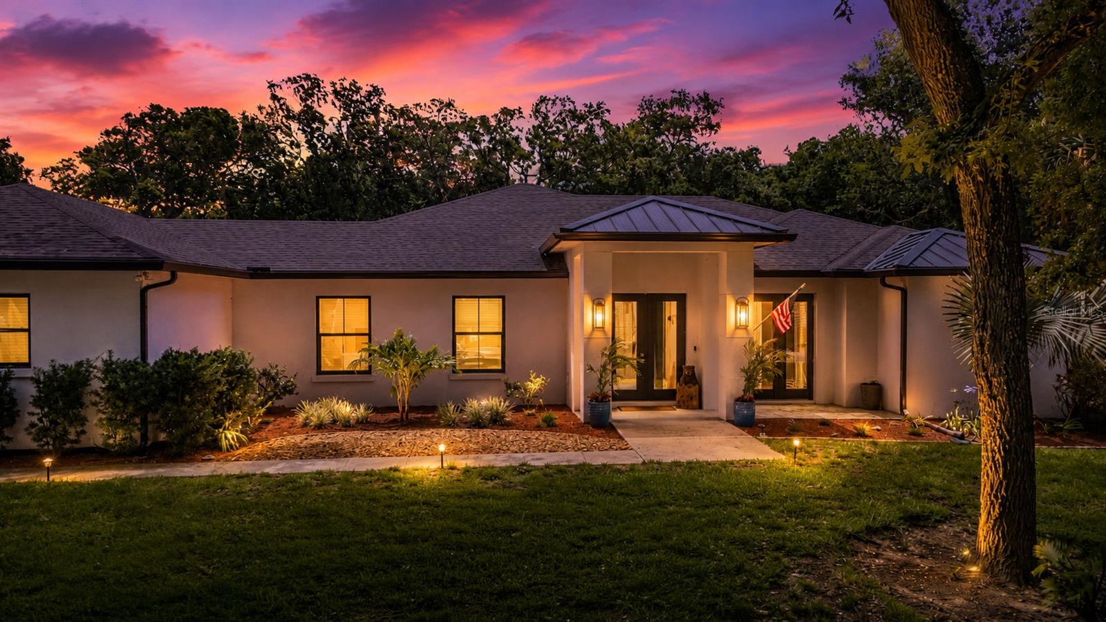 Virtually Staged. Rare Coastal Luxury Estate – East of A1A on a Private Acre

An extraordinary opportunity to own a rare 1-acre estate east of A1A, ideally positioned between the Atlantic Ocean and the Intracoastal Waterway in one of Flagler County's most desirable coastal enclaves. Located on a secluded, gated cul-de-sac and surrounded by protected nature preserve, this exceptional property offers the perfect balance of privacy, luxury, and the Florida lifestyle that discerning buyers seek.

The estate features a brand-new modern 4-bedroom, 3-bath residence, complemented by a private 1-bedroom, 1-bath guest house with a full kitchen. Ideal for extended family, guests, a private office, or income-producing opportunities, the guest house offers exceptional flexibility and value.

Designed for effortless indoor-outdoor living, the resort-style outdoor space includes a screened lanai with a sparkling pool, spa, outdoor kitchen, and lounge area, creating the ultimate setting for entertaining or relaxing year-round. Elegant white marble surfaces enhance the kitchen and baths, while porcelain flooring throughout delivers a sophisticated, contemporary aesthetic.

For boating and recreational enthusiasts, the property offers a 3-car garage, plus a substantial covered boat and RV storage area complete with hookups. Enjoy the convenience of taking your golf cart to nearby Flagler Beach, then return home to rinse off in the outdoor shower before entering through a private owner's entrance.

Additional luxury features include a whole-house Generac generator system, providing peace of mind during any season.

Just minutes from Flagler Beach's charming restaurants, boutiques, and oceanfront attractions, this remarkable estate combines architectural excellence, modern amenities, exceptional privacy, and endless opportunities for entertaining. Whether as a primary residence, luxury retreat, or investment opportunity, this is coastal Florida living at its finest.