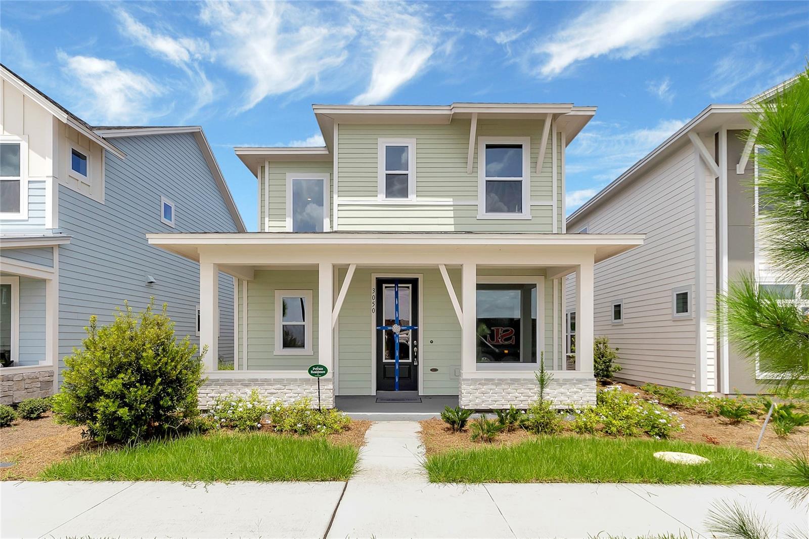 Welcome to this stunning move-in-ready home in the highly desirable Wesley Park community! Offering 3 bedrooms, 2.5 bathrooms, 2,117 square feet of thoughtfully designed living space, and a 2-car garage, this popular Zeppelin floor plan perfectly blends modern elegance with everyday functionality.

Step inside to a bright, open-concept layout highlighted by a dramatic two-story family room that fills the home with natural light and creates an impressive sense of space. The chef-inspired kitchen is the heart of the home, featuring quartz countertops, a large center island with seating, stainless steel appliances, built-in oven and microwave, abundant cabinetry, and seamless flow into the dining and living areas—perfect for entertaining or enjoying everyday life.

Relax on the welcoming covered front porch or unwind on the covered rear lanai, offering comfortable outdoor living spaces for morning coffee, evening gatherings, or simply enjoying Florida's beautiful weather.

Upstairs, the spacious owner's retreat offers a private sanctuary complete with a spa-inspired en-suite bathroom featuring dual vanities, a walk-in shower, and a generous walk-in closet. A versatile loft overlooks the soaring family room below, creating the ideal space for a media room, home office, or play area. Two additional bedrooms share a well-appointed full bathroom, providing plenty of room for family or guests.

Located in the sought-after Wesley Park community, residents enjoy resort-style amenities including a community pool, playground, and scenic walking trails. Conveniently situated just minutes from Florida's Turnpike, Lake Nona Medical City, Orlando International Airport, shopping, dining, and top-rated schools, this exceptional home offers the perfect combination of comfort, convenience, and Florida living.