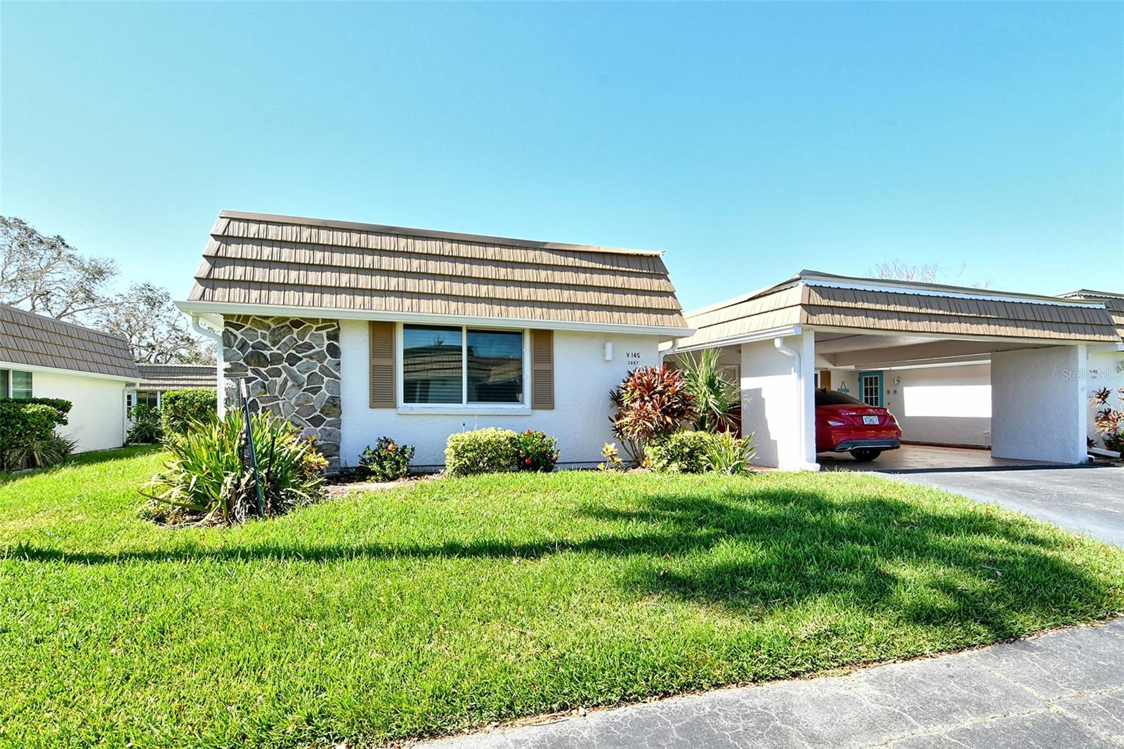 SUBSTANCIAL PRICE REDUCTION ---REINTRODUCED AT AN ATTRACTIVE NEW PRICE POINT AND AGRESSIVELY PRICED FOR TODAY'S MARKET.  Experience the perfect blend of comfort, style, and coastal living in this beautifully updated, single-level villa, steps away from all amenities, nestled within a highly desirable 55+ waterfront community. This move-in-ready residence offers 2 spacious bedrooms, 2 bathrooms, and a thoughtfully designed floor plan that combines modern finishes with timeless appeal. Step inside to discover a light-filled interior with luxury vinyl flooring, updated lighting, and elegant touches throughout. The kitchen boasts granite countertops, stainless steel appliances, and seamlessly flowing into the open-concept living/dining areas. New roof and gutters (2024) add peace of mind, while large windows fill the home with natural light, creating an inviting, airy atmosphere. This active, resort-style community offers an exceptional array of amenities only steps away, designed for recreation and relaxation. Enjoy a heated swimming pool, clubhouse, fitness center, sauna, library, and a billiards room. The on-site marina features dock available on a first-come, first-served basis for just $1,344 year, offering access to the Intercoastal, perfect for the boating enthusiast.  The community’s robust social calendar includes planned activities, live entertainment, card games, and casual gatherings, fostering a vibrant and friendly neighborhood atmosphere. Perfectly situated just minutes from world-renowned Siesta Key Beach and only a short drive to downtown Sarasota.  Two pets allowed (subject to HOA size). This meticulously maintained property truly embodies the Florida lifestyle—relaxed, refined, and effortlessly enjoyable.   MONTHLY FESS INCLUDE TRASH REMOVAL, WATER, SEWER AND BASIC CABLE. Don't miss out on this wonderful opportunity., call to see it today and make it your home!!