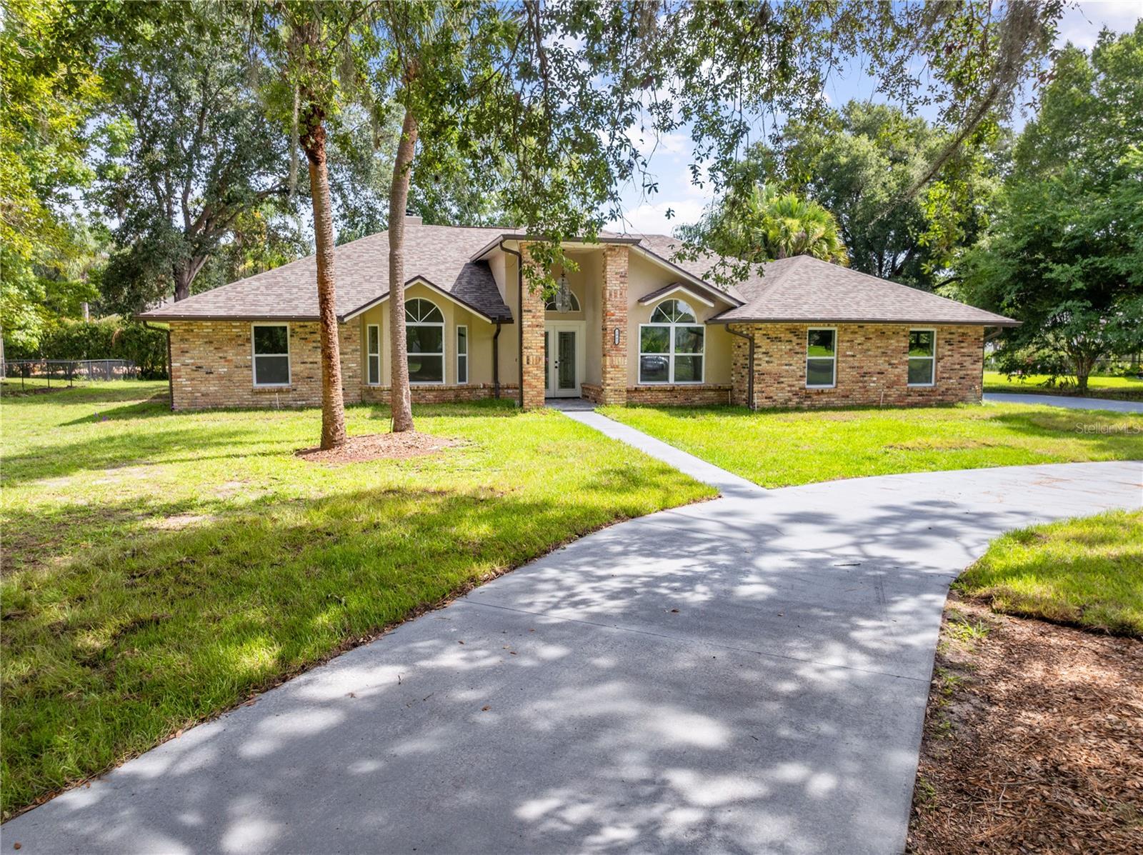 Welcome to your beautifully remodeled home in the gated community of Camelot!
Situated on just under a ¾-acre lot, this move-in-ready property has been thoughtfully updated throughout. Recent improvements include new tile flooring, energy-efficient windows, new ceiling fans, light fixtures, a new roof, fresh interior and exterior paint, and fully renovated bathrooms.
The stunning new kitchen features quartz countertops, stainless steel appliances, and modern finishes that blend style and functionality. The spacious floor plan offers exceptional flexibility for both everyday living and entertaining.
Enjoy year-round comfort in the oversized Florida room, complete with a new mini-split system and direct access to the screened pool area. The primary suite is a private retreat, featuring pool access, a walk-in closet with a barn door, dual vanities with quartz countertops, and a beautifully updated glass-enclosed shower.
Outside, the oversized screened pool has been refinished and equipped with new pool equipment, while the expansive pool deck creates the perfect setting for entertaining family and friends. Additional highlights include an oversized two-car garage with attic access, new pegboard storage, and freshly stained flooring.
This exceptional home combines modern upgrades, generous living spaces, and resort-style outdoor amenities in a desirable gated community.  Low HOA fees and NO CDD.
Schedule your private showing today!