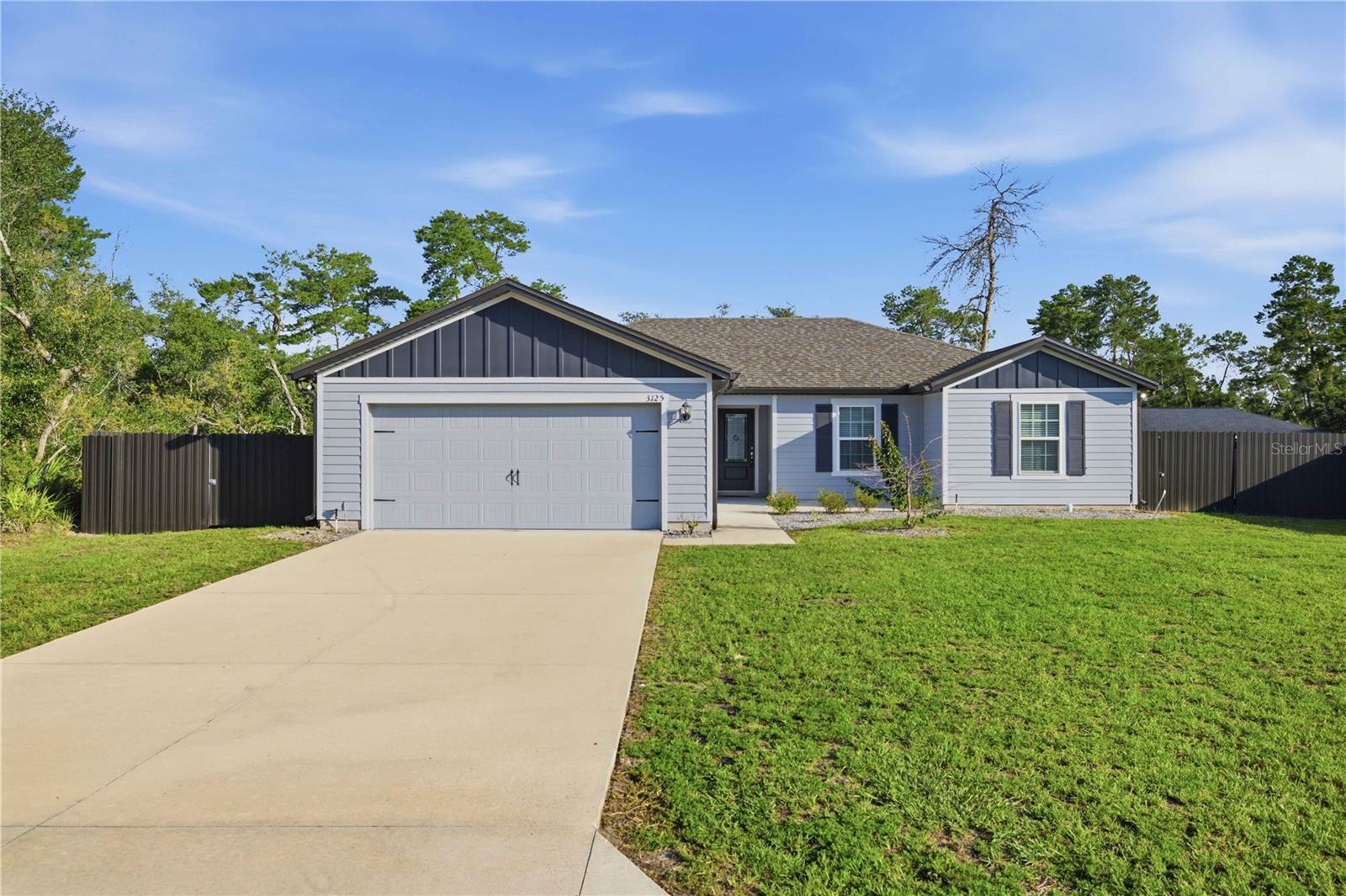 CHARMING and PRISTINE 2024 Move-In Ready Home in Marion Oaks. Nestled in a peaceful Marion Oaks neighborhood, this pristine 2024-built home perfectly balances modern efficiency with cozy, quaint charm. Boasting excellent curb appeal with stone landscaping and a welcoming front patio, this 3-bedroom, 2-bathroom residence features an open, split-floor plan complete with a versatile flex room—ideal for a home office, gym, or playroom. Inside, the bright and inviting living room features airy vaulted ceilings and durable luxury vinyl plank flooring throughout the main living areas. The open kitchen is a chef’s delight, equipped with a functional center island, granite countertops, under-cabinet lighting, stainless steel appliances, and upgraded fixtures. Retreat to the spacious primary suite, highlighting vaulted ceilings, a large walk-in closet, and an ensuite bath with a custom-tiled glass shower and quartz-top vanity. The standout feature of this property is the expansive, private 38x12 screened lanai. Outfitted with privacy screening and dual ceiling fans, it offers a seamless indoor-outdoor living experience looking out to the fully fenced backyard with secure aluminum fencing. Additional upgrades include a two-car garage, seamless gutters, and a hardwired ADT security camera system. Enjoy quiet, modern living just minutes from Central Florida's best outdoor recreation.