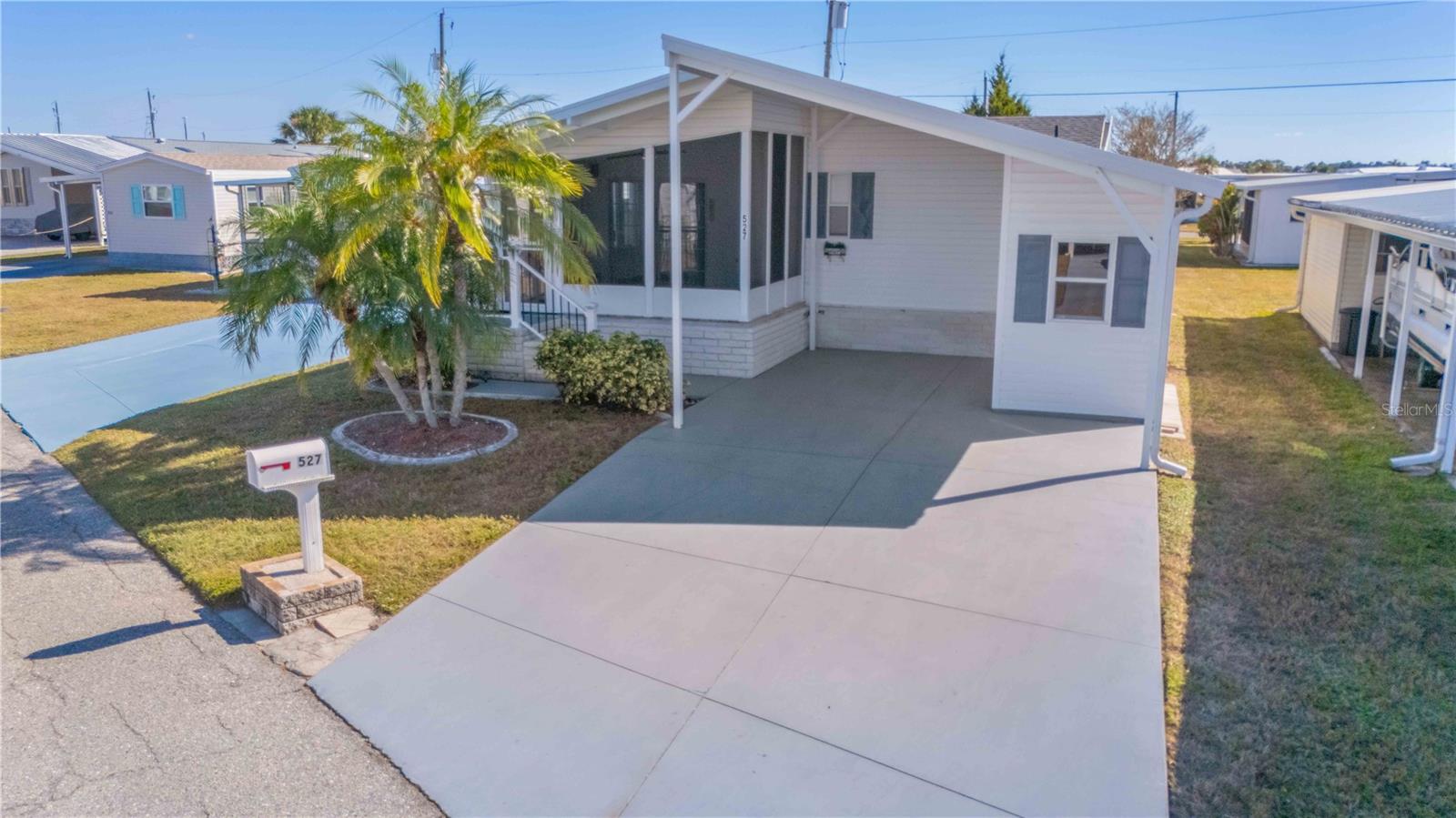 Welcome to Harbor Cove, one of North Port’s most desirable 55+ communities — where comfort, convenience, and an unbeatable Florida lifestyle come together. This spacious modular home has been thoughtfully updated and is truly move-in ready. Recent improvements include a new roof, a brand-new carport, a new AC unit, and several interior upgrades such as updated flooring, giving the home a fresh and inviting feel. Harbor Cove offers an impressive array of amenities and activities to keep you as active and social as you desire. Enjoy tennis, pickleball, shuffleboard, bocce, and horseshoes, all just steps from your door. For boating enthusiasts, the community features a full-service marina, making days on the water easily accessible. You’ll also love the two heated pools, relaxing hot tub, and a variety of additional recreational options. If you’ve been searching for an affordable way to embrace the ultimate Florida lifestyle, this home delivers exceptional value in a vibrant, welcoming community. Don’t miss your chance — this one won’t last!