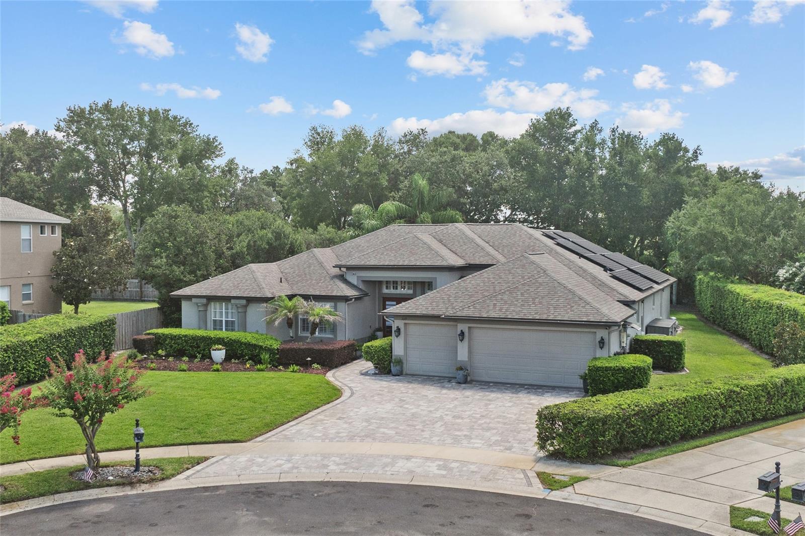 Under contract-accepting backup offers. Completely redesigned with style, entertaining, and modern living in mind, this exceptional, single-story, pool home is one of the finest opportunities to become available in gated Oaks of Windermere. Offering more than 3,000 square feet, and a $250,000 beautifully executed renovation, this five-bedroom residence was thoughtfully reimagined around today's lifestyle, creating an open, light-filled floor plan filled with natural light and exceptional functionality. Walls were removed to seamlessly connect the kitchen, dining, and great room, creating an inviting space that lives as beautifully, and easily, as it entertains. At the heart of the home, the stunning, renovated kitchen features a premium GE Café range, soft-close cabinetry, elegant stone countertops, an oversized island and an open design that naturally brings everyone together, from everyday dinners to memorable gatherings with family and friends. A spacious, breakfast nook looks onto your backyard oasis and features a wet bar with reverse osmosis system. Beautifully updated bathrooms continue the home’s fresh, transitional style, while the primary bath enjoys its own dedicated, tankless hot water heater. The flexible, fifth bedroom is currently used as a home office, offering the ideal work-from-home space. Through sliding glass doors, step outside to your own private, backyard retreat, where a screened, saltwater pool, summer kitchen and fire pit area surrounded by an expanded paver patio, invite year-round outdoor living. Rarely found in this community, the oversized, private backyard offers exceptional space to relax, play, or entertain, while the large, landscaped front yard creates equally impressive curb appeal. And the grounds are irrigated with a well added by the sellers, significantly reducing your water bill! An expanded, paver driveway leads to the spacious, three-car garage, complete with a Tesla charging station, where you'll also find a hybrid hot water heater which pulls heat from the garage! Additional upgrades include fully paid for, whole-house solar panels, smart home lighting, and a new Electrolux washer and dryer that convey with the home. Perfectly situated on a prime cul-de-sac lot within gated Oaks of Windermere, this home is zoned for highly sought-after Thornebrooke Elementary and award-winning Olympia High School. Enjoy unmatched convenience to Winter Garden Village, featuring a Super Target, Best Buy and Lowe's, as well as other shopping and dining options. Charming Downtown Windermere with its weekly farmers market and monthly Food Truck Nights are a bike ride away, while famed Restaurant Row in Dr. Phillips is less than a 15 minutes drive. Want to live where it's easy to frequent Universal Studios and Walt Disney World? This home is situated between the two parks, only 15 minutes to Universal and you can be on Disney's doorstep in less than a half hour. With easy access to the Florida Turnpike, SR-429, and SR-408, you can be in downtown Orlando in less than 20 minutes or be on the beach in an hour and change. Homes that combine this level of renovation, a single-story layout, an oversized private yard, and a gated Gotha location nestled along the Windermere town limit, rarely come to market. Schedule your private showing today and experience firsthand the lifestyle, quality, and convenience that make this exceptional home truly one of a kind!
