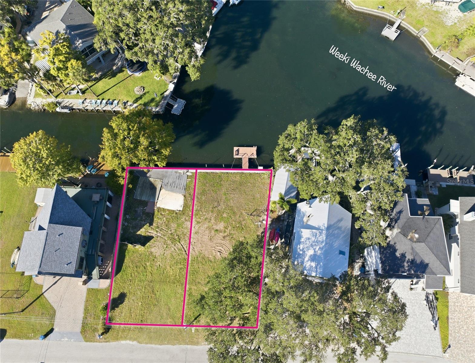 BIG PRICE IMPROVEMENT! Discover an extraordinary riverfront opportunity on the 7.5 mile spring-fed Weeki Wachee River, where TWO adjacent buildable lots are available for purchase! Price is per lot, with the option to buy one or both. Each parcel boasts 50 feet of concrete seawall and gorgeous views across the wide riverbend, offering direct access to crystal-clear freshwater springs upstream and the open Gulf of America downstream. The east lot features a private boat dock, perfect for effortless launches of your kayak/paddle board, while both lots provide a short paddle to the locally loved Upper Deck restaurant and Rogers Park. With no HOA or short-term rental restrictions, these properties present the flexibility to build your dream home, an income-producing rental or just a place to launch your kayaks and spend the weekend. Nestled among local dining options and recreational amenities for outdoor enthusiasts. Secure a piece, or two, of paradise for yourself!